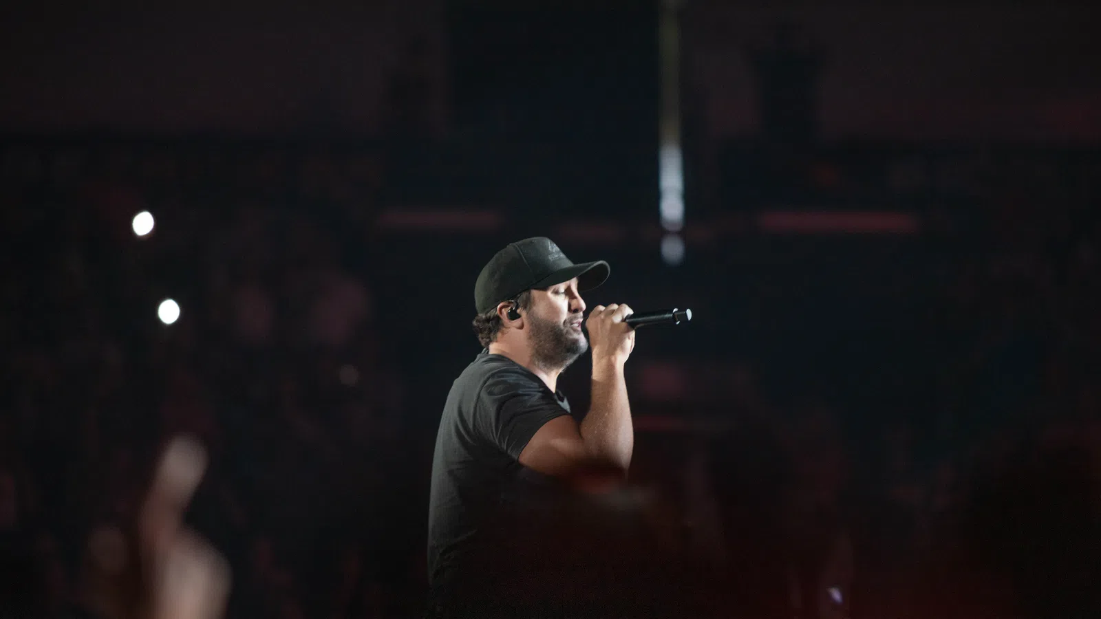 a man singing into a microphone