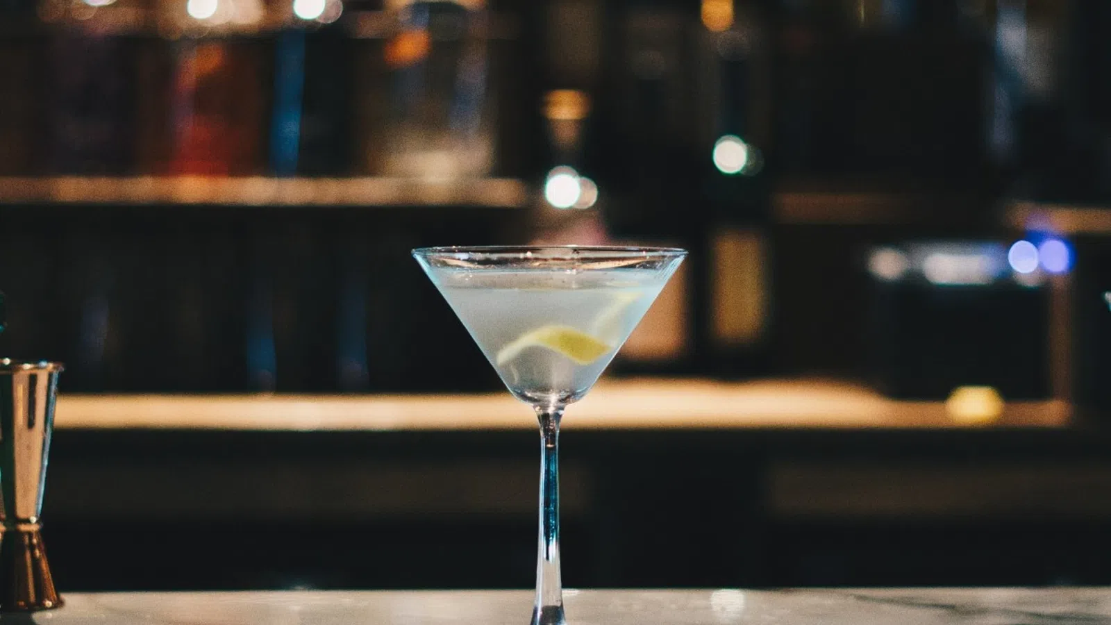 a glass of white liquid on a table