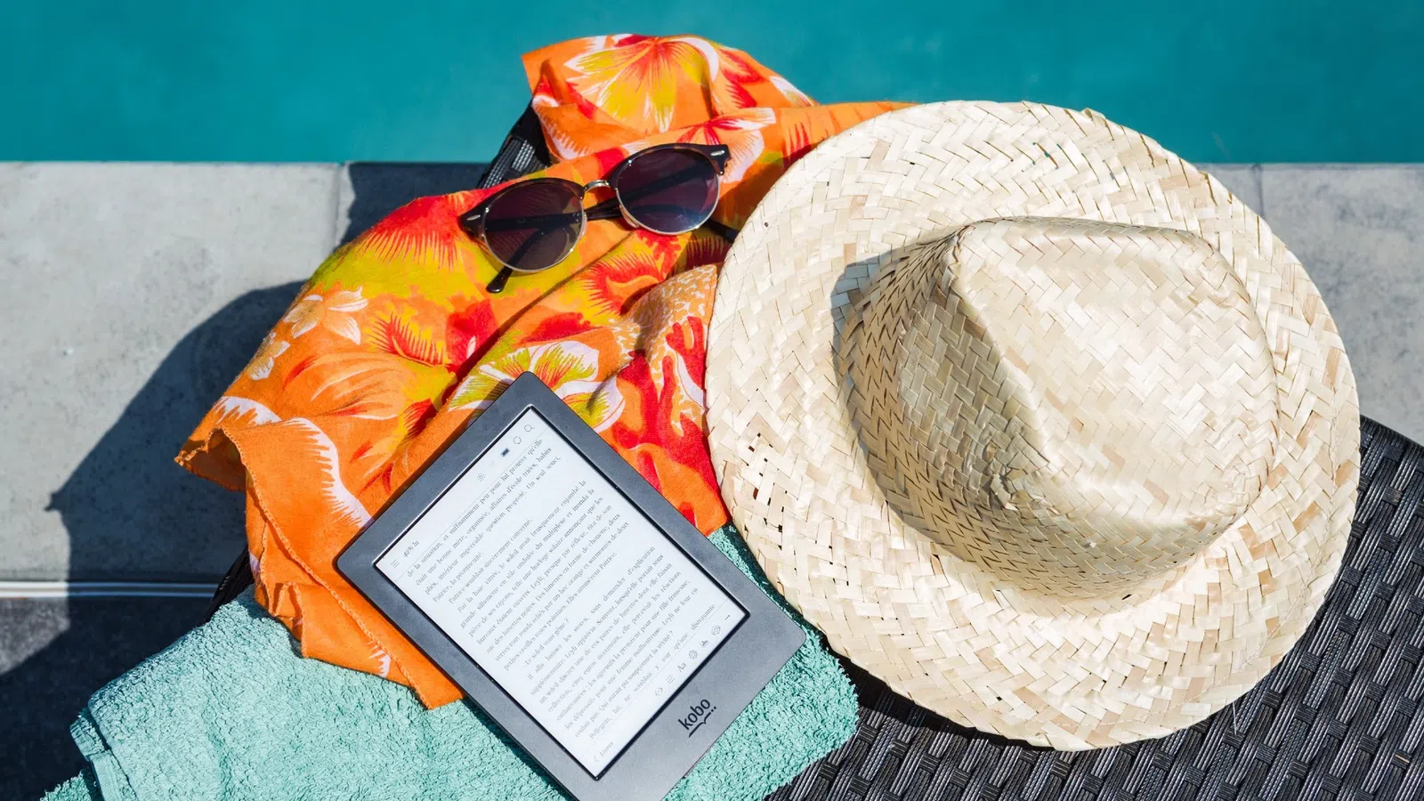 a hat and a book on a blanket