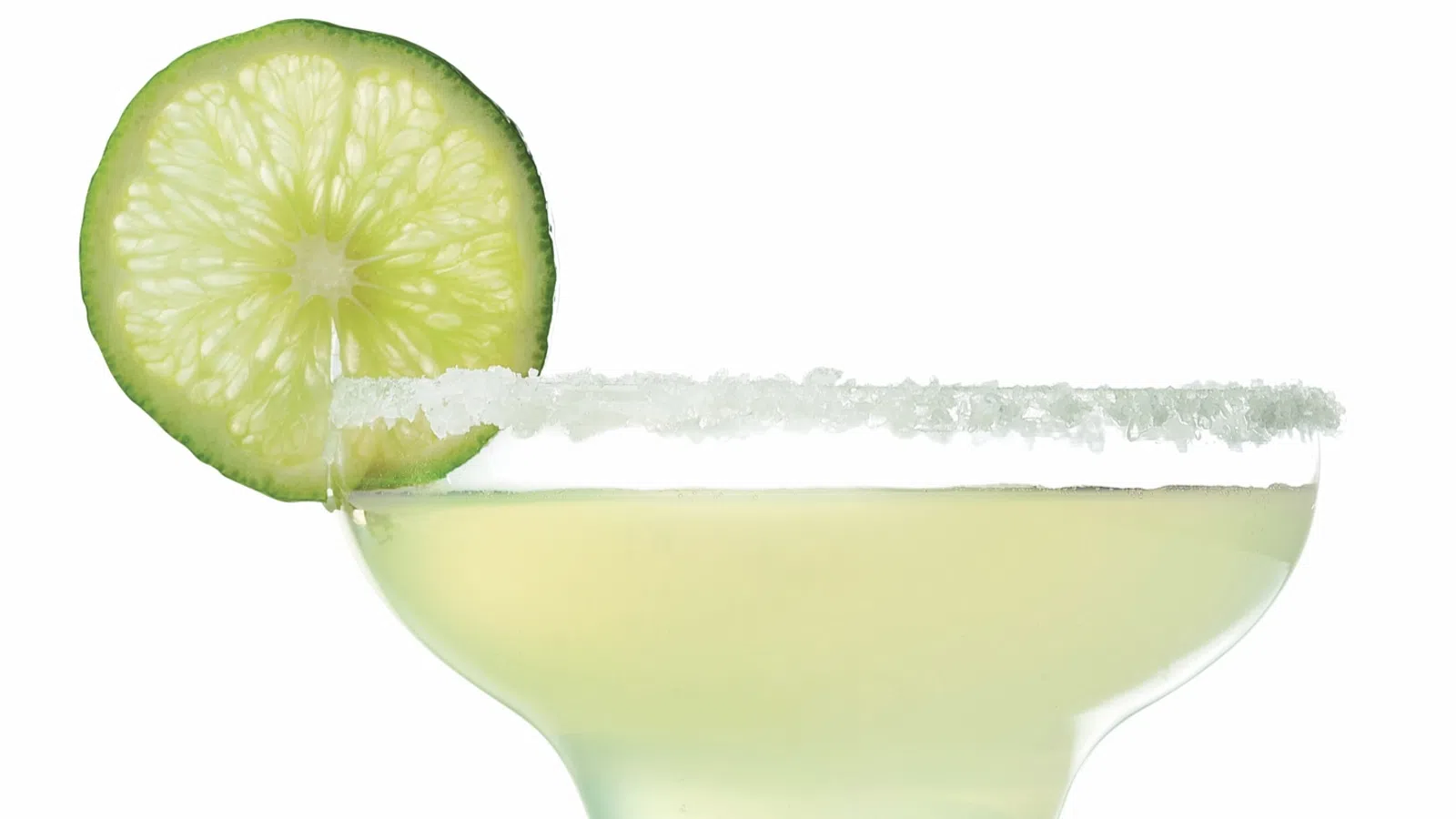 a glass with a lime wedge in it