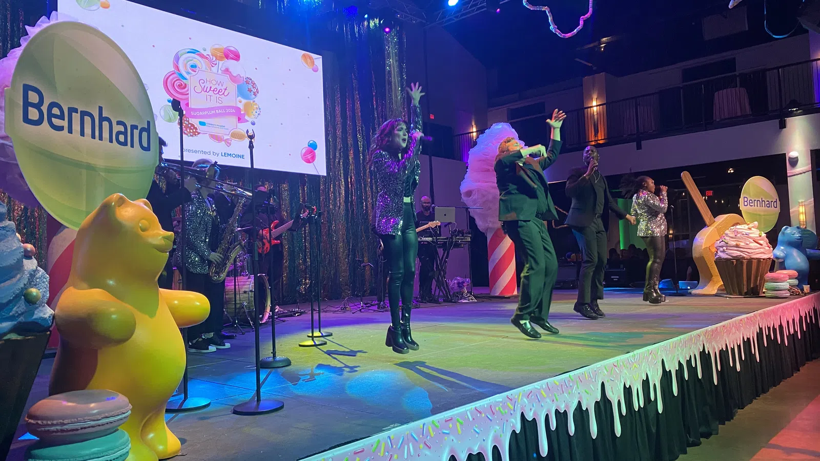 a group of people performing on a stage
