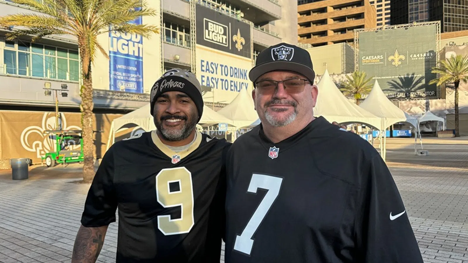two men wearing black shirts