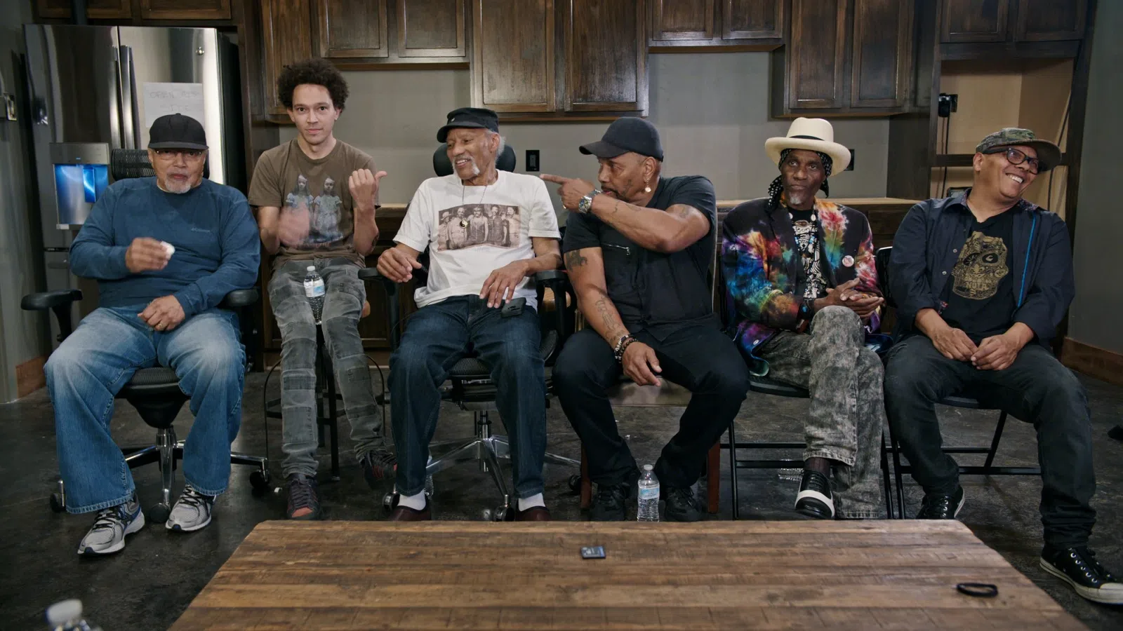 a group of men sitting on a bench