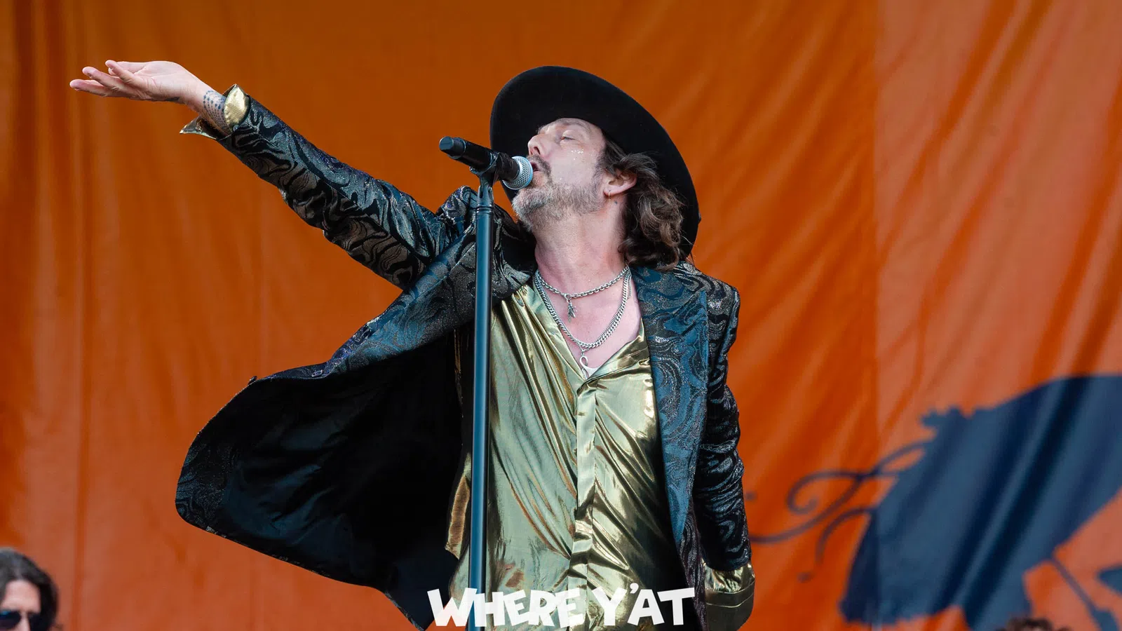 a man singing into a microphone