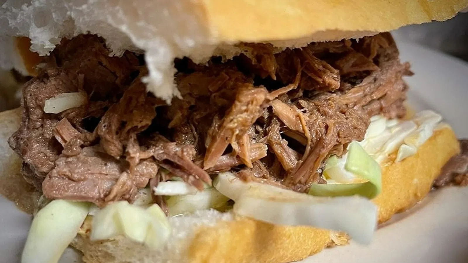 a sandwich with meat and vegetables