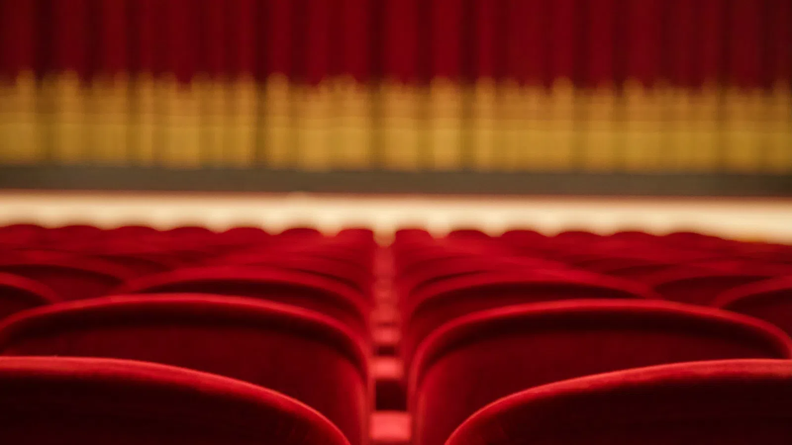 a red curtain with a yellow line