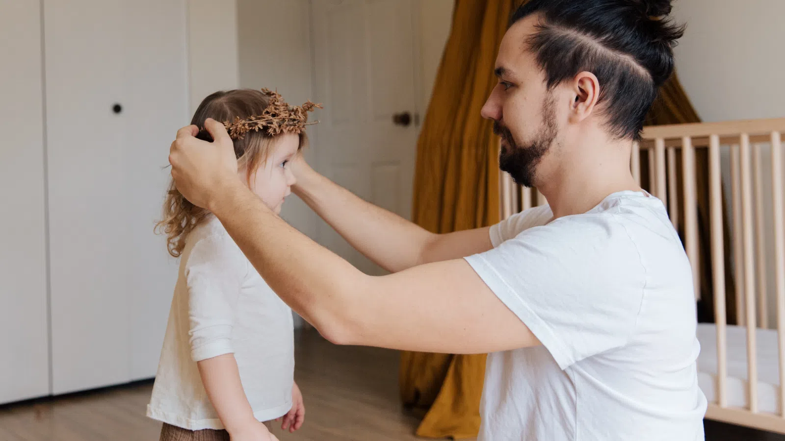 a person holding a little girl