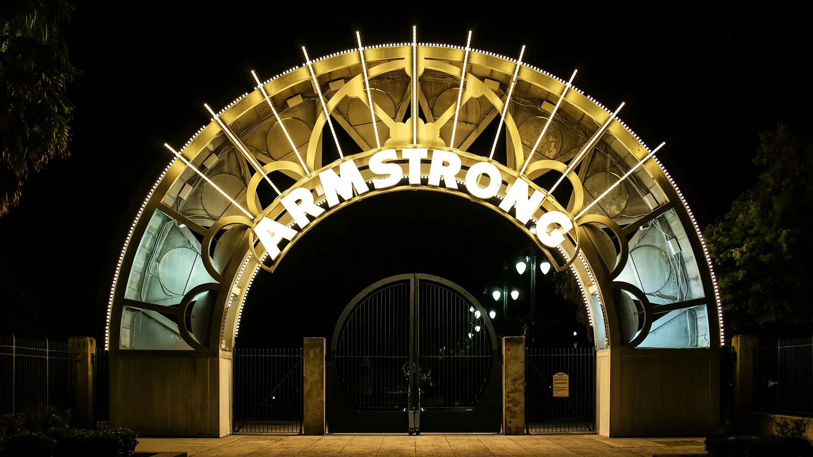 a large gold gate with a circular design on it