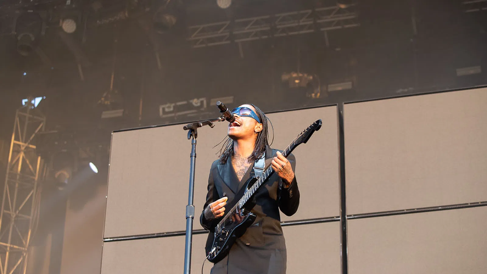 a man playing guitar on stage