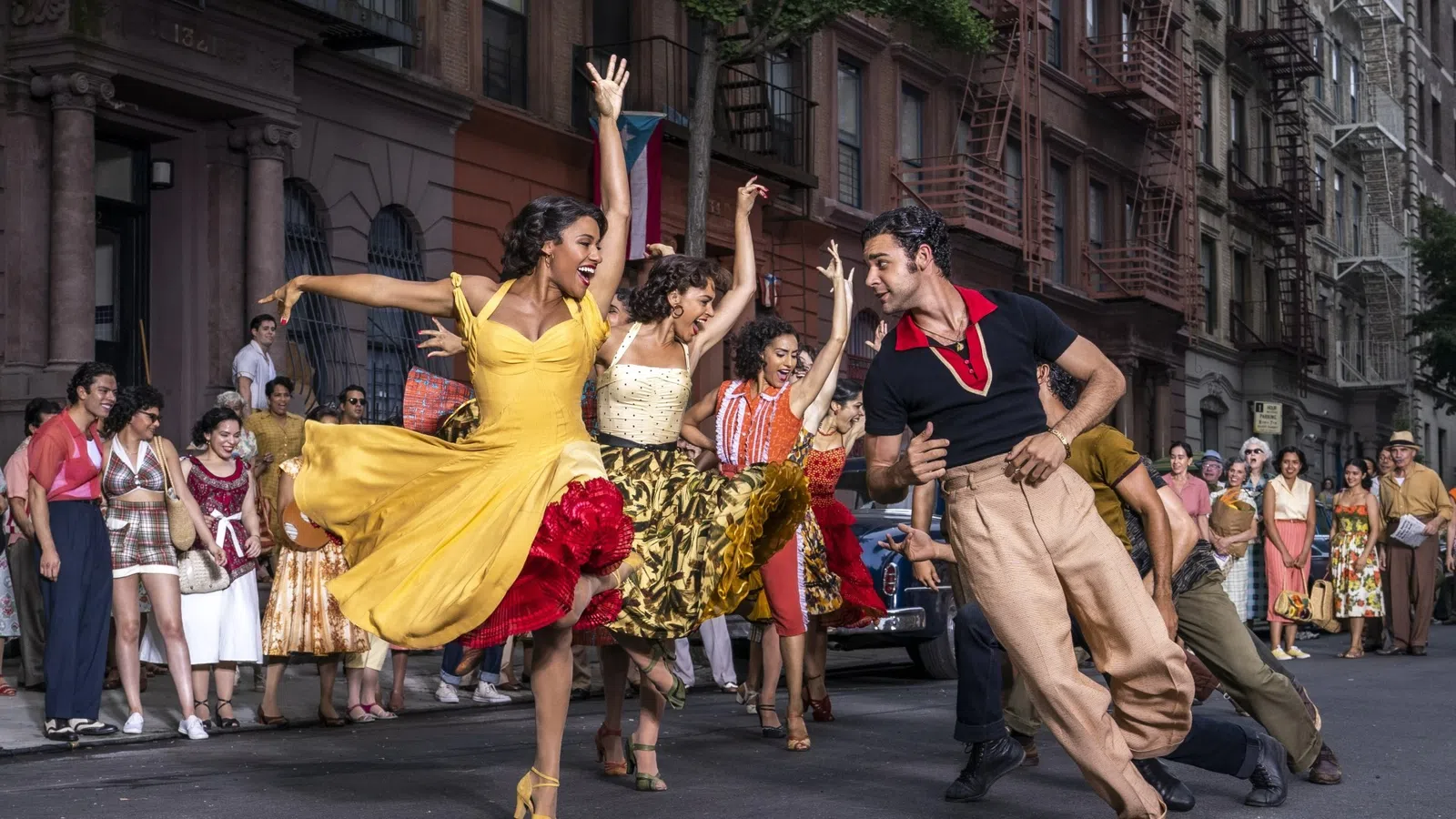 a group of people dancing in a street