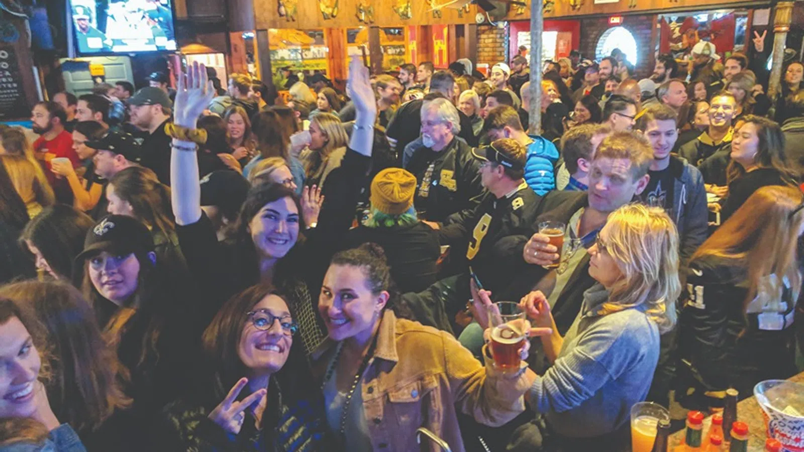 a large group of people at a bar