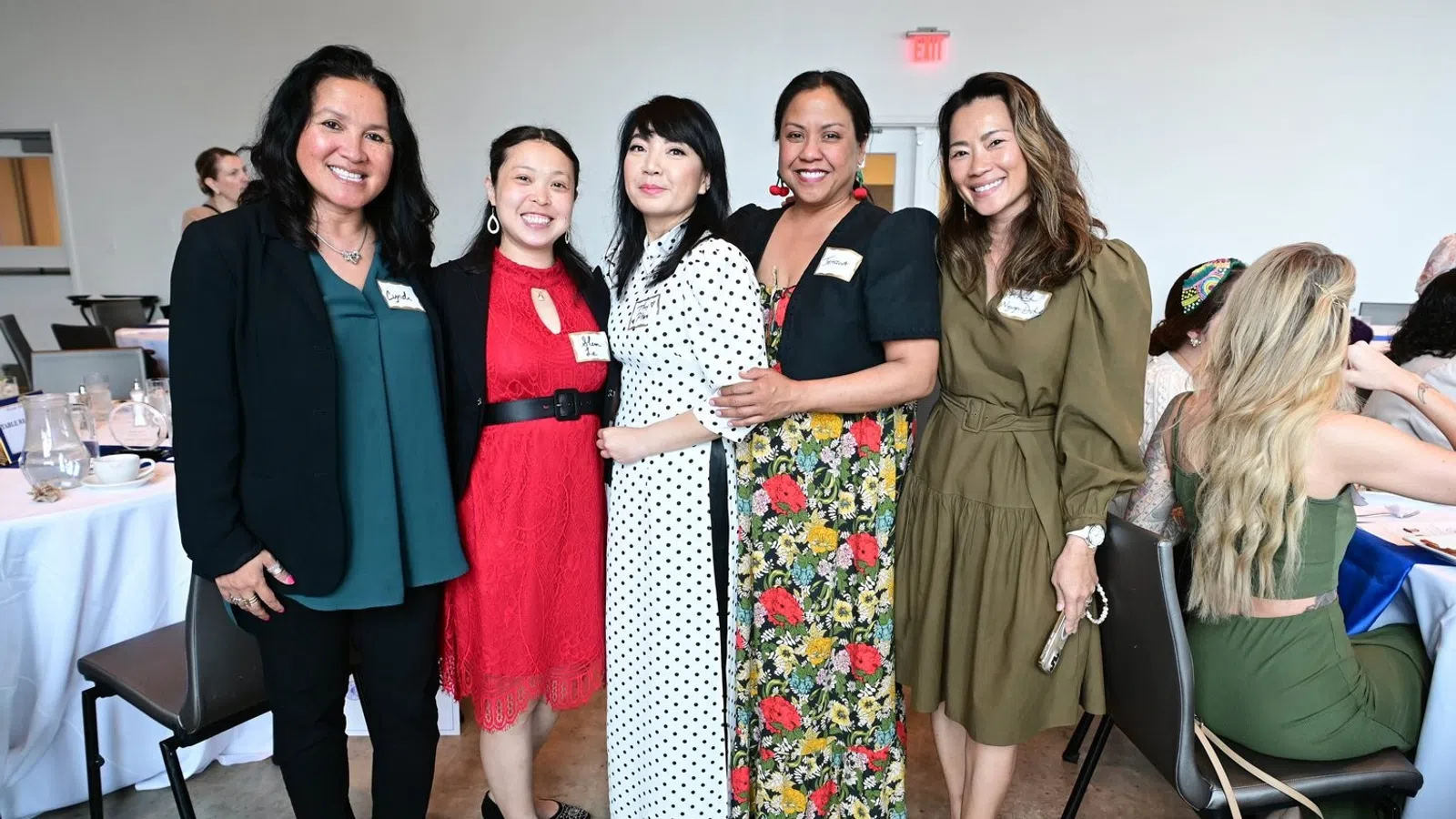 a group of women posing for a photo