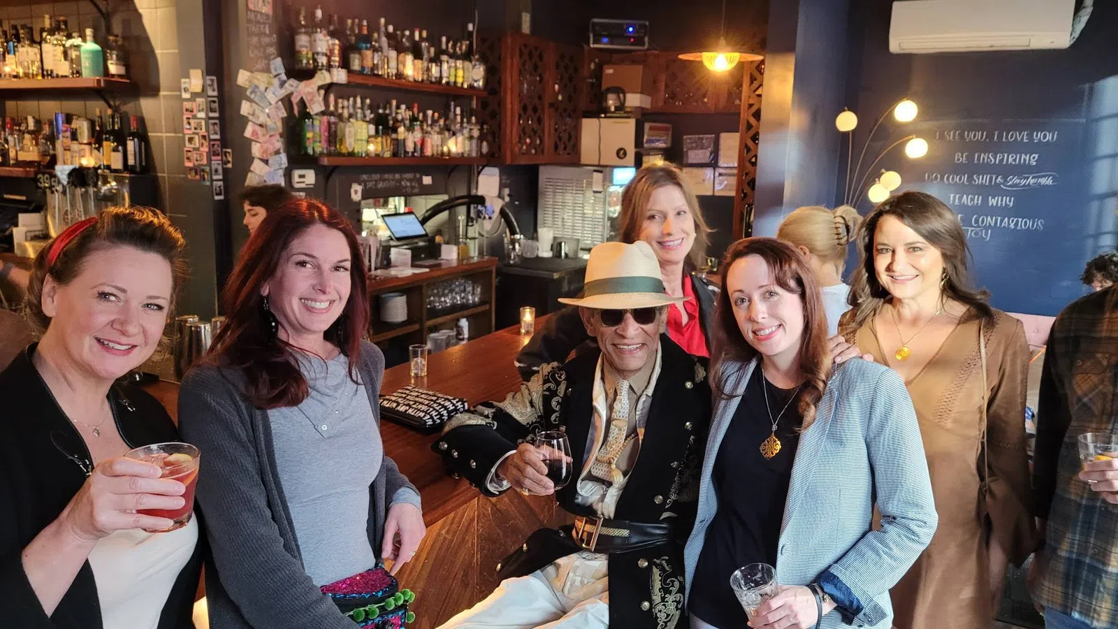 a group of women posing for a photo