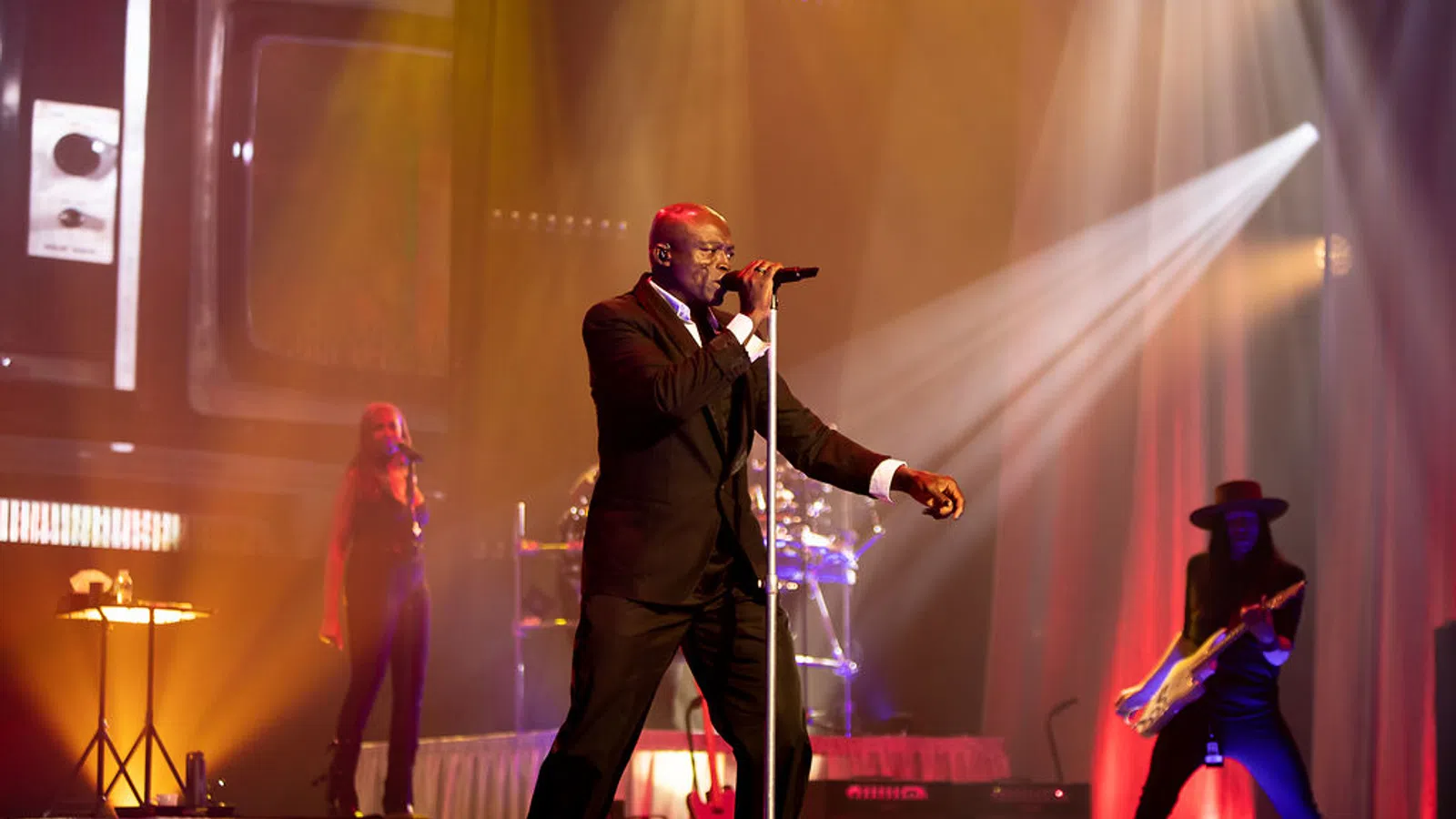 a person singing on a stage