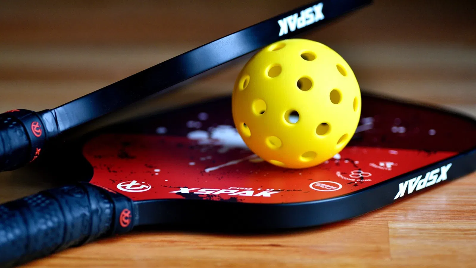 a knife next to a yellow ball