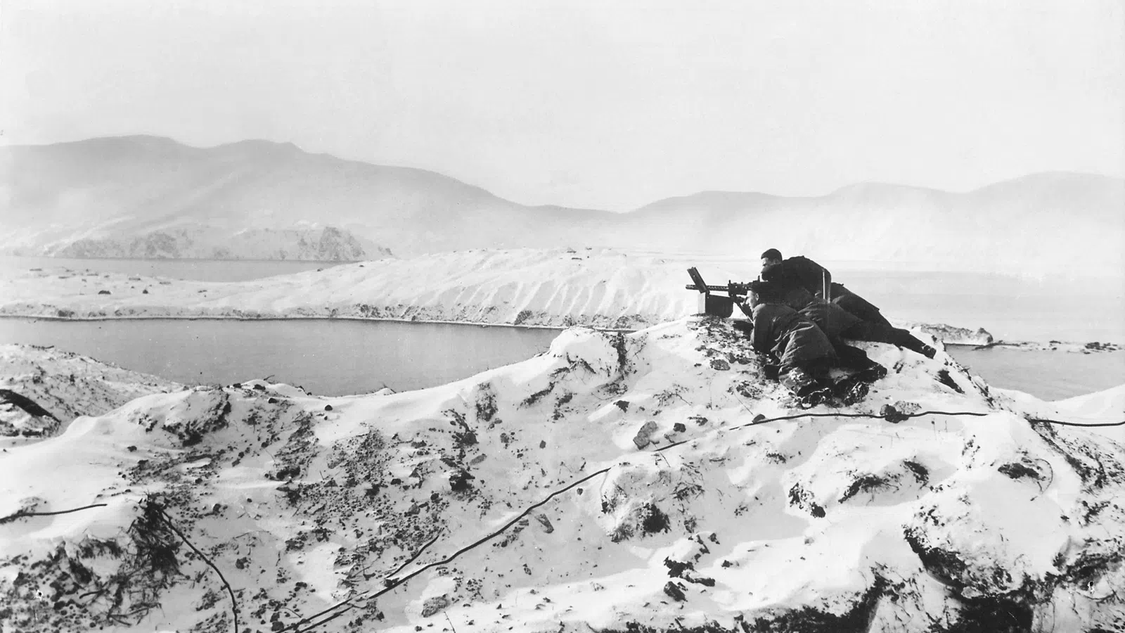a person sitting on a snowy mountain