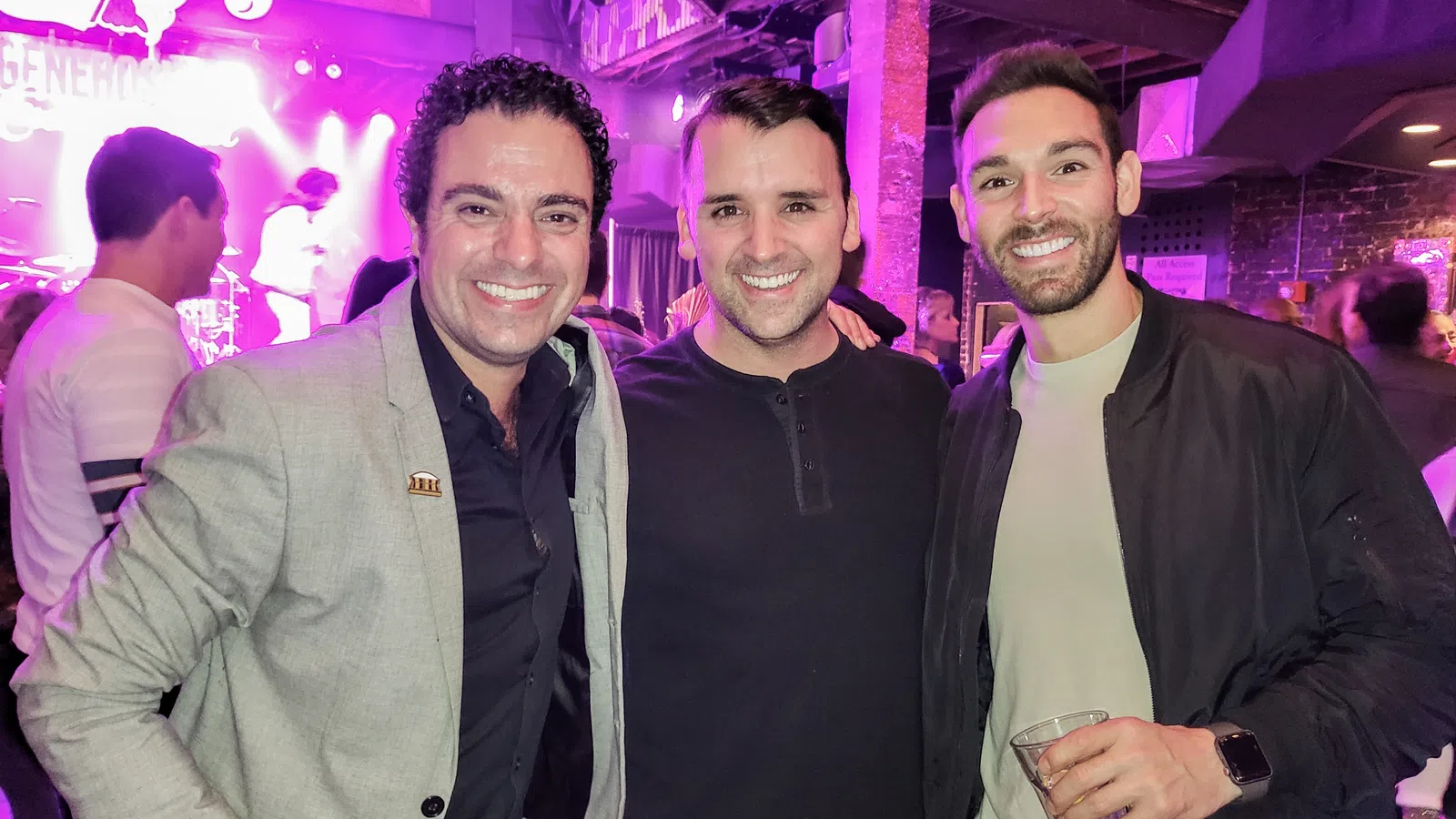 a group of men posing for a picture
