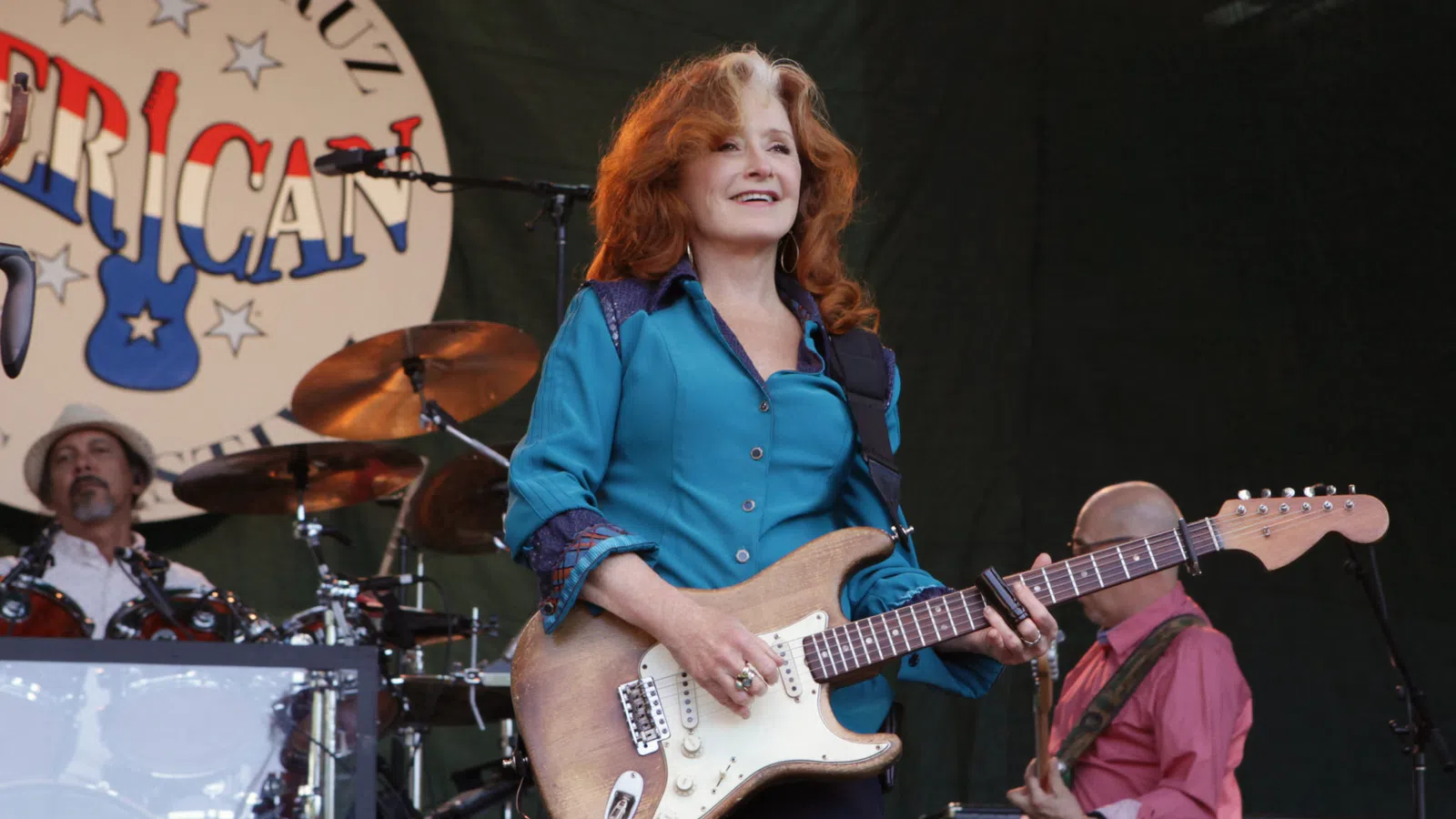 Bonnie Raitt playing a guitar