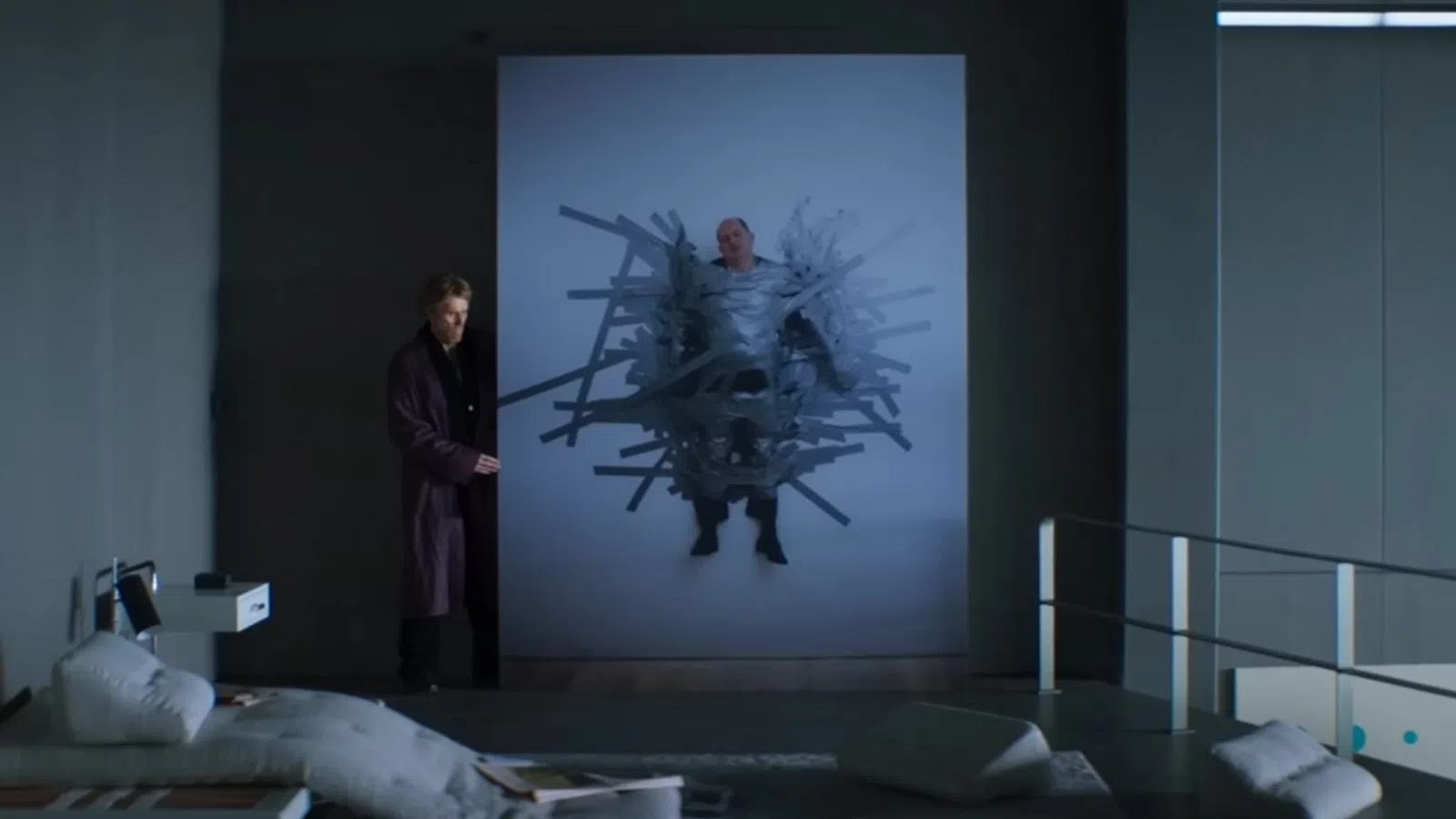 a person standing in front of a projector screen