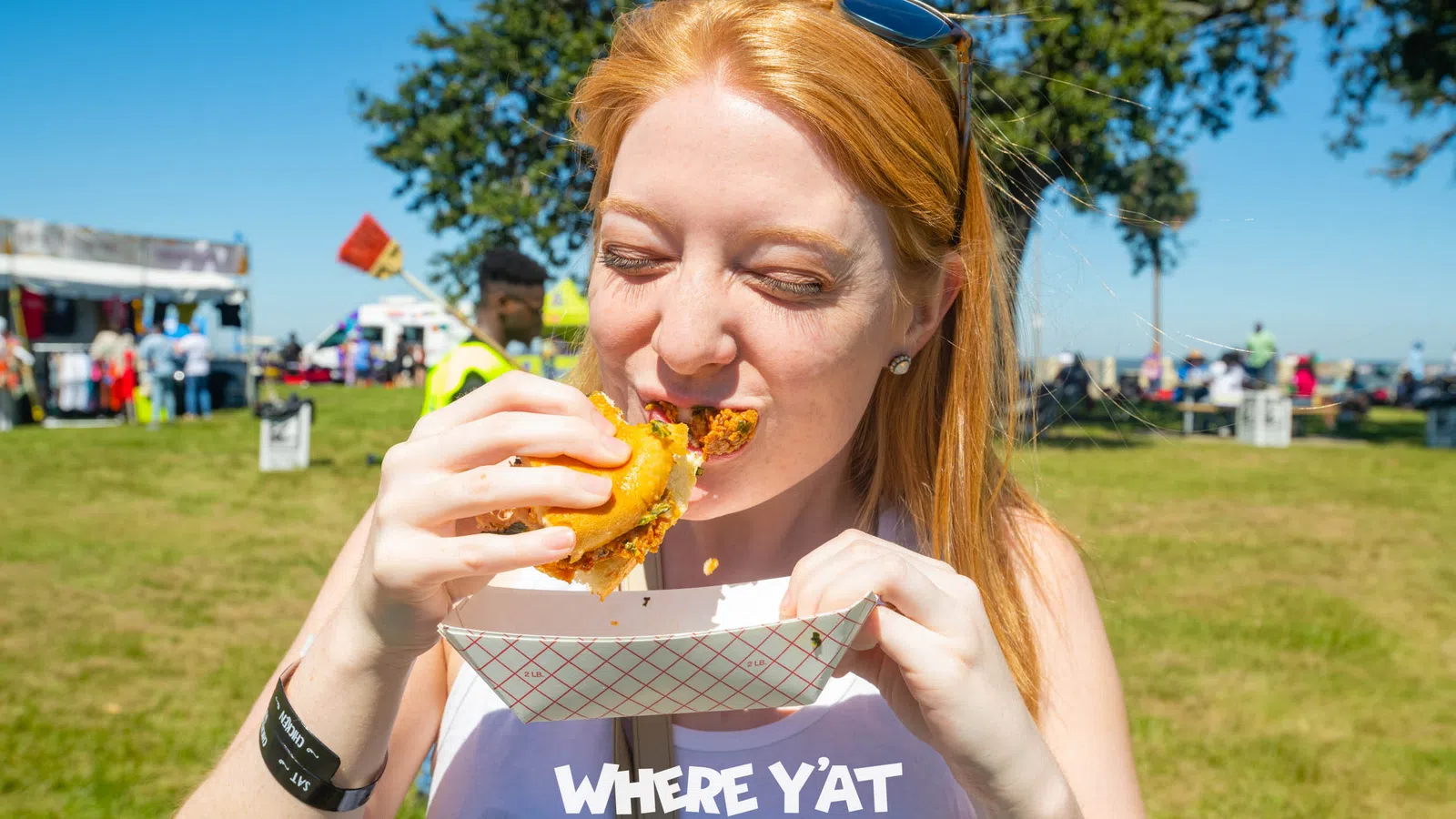 a person eating a hot dog