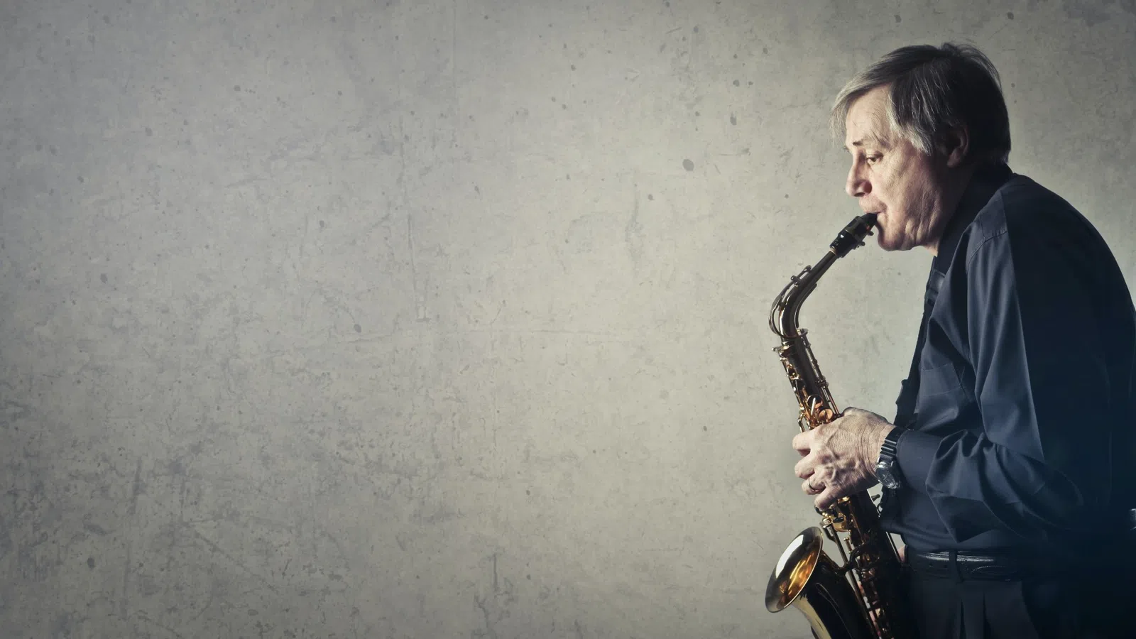 a man playing a saxophone