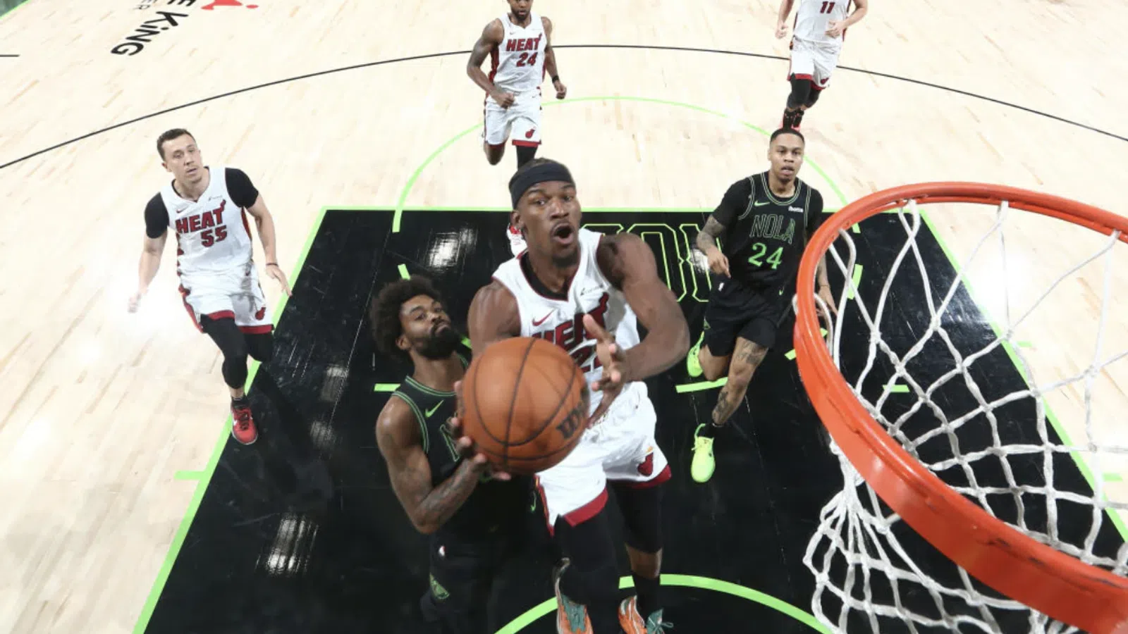 a group of men playing basketball