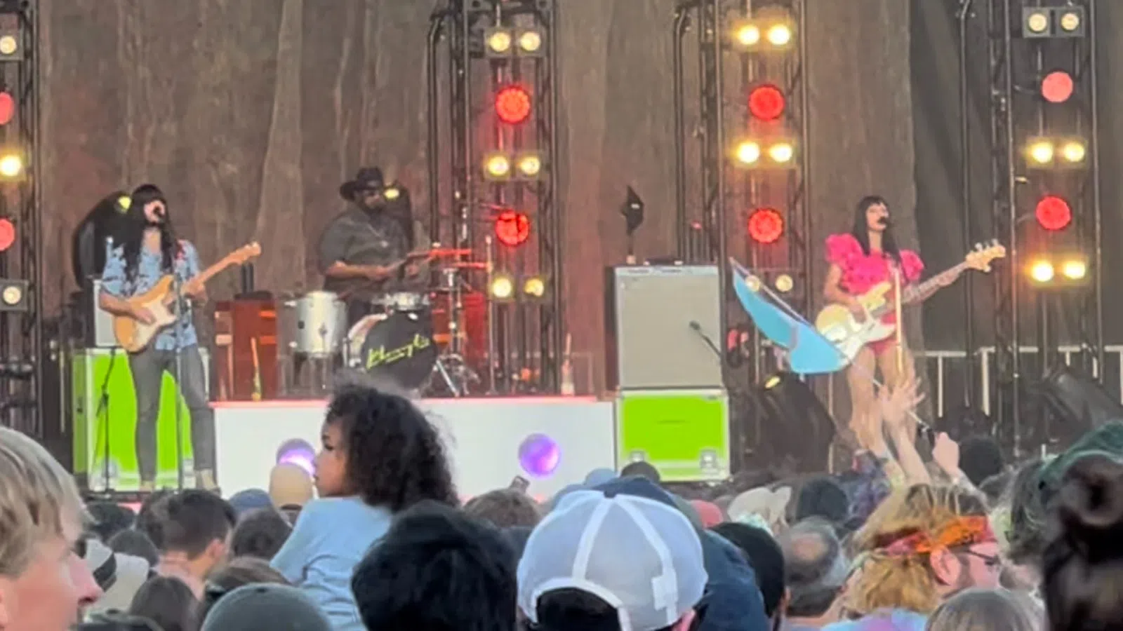 a group of people playing instruments on a stage