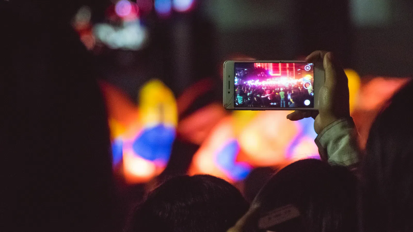 a person holds a cell phone