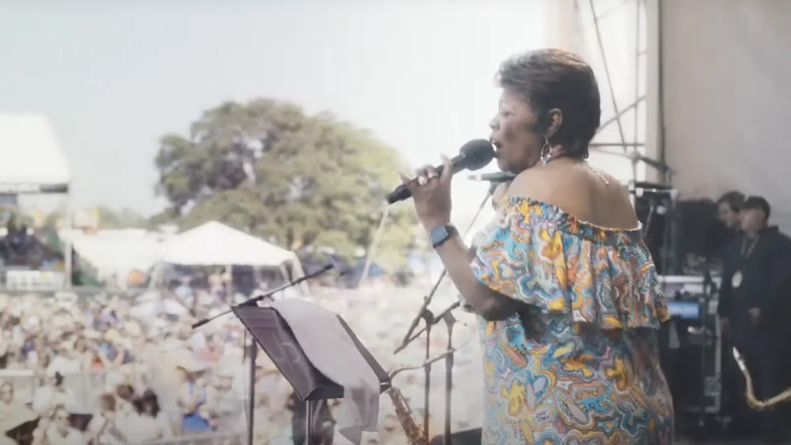 a person singing into a microphone