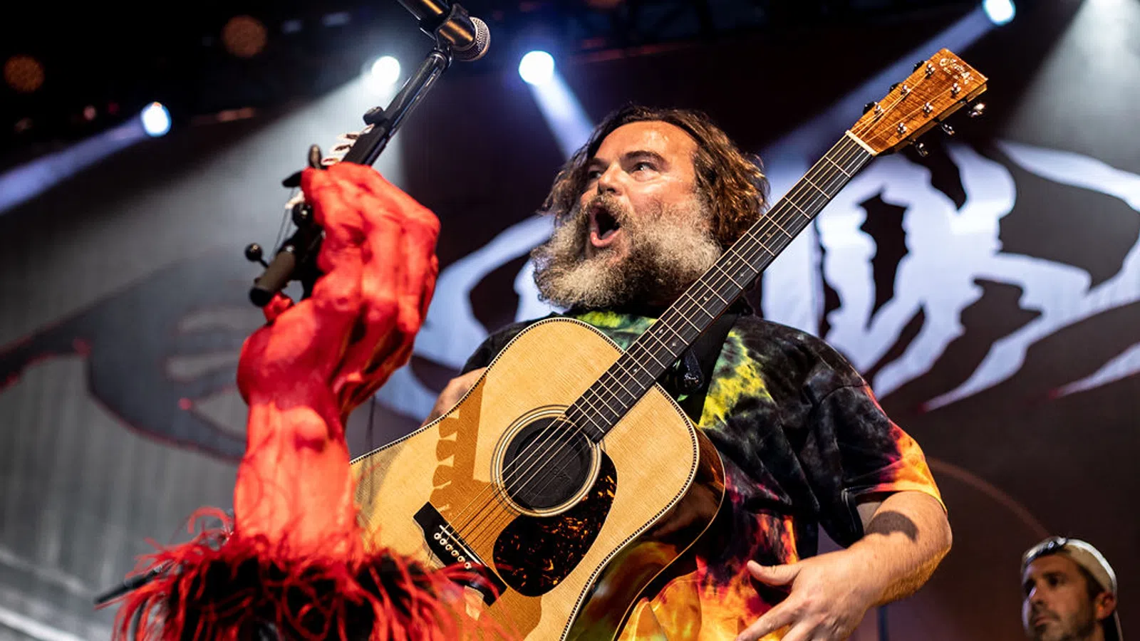 Jack Black playing a guitar