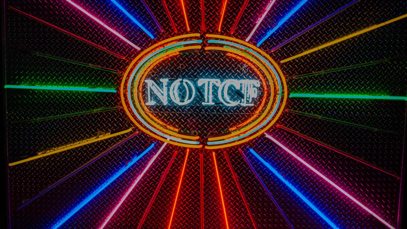 Vibrant neon sign with the word NOTCH encircled by glowing orange rings and radiating colorful light beams.