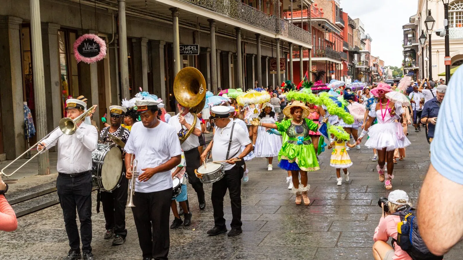 a group of people playing instruments on a street