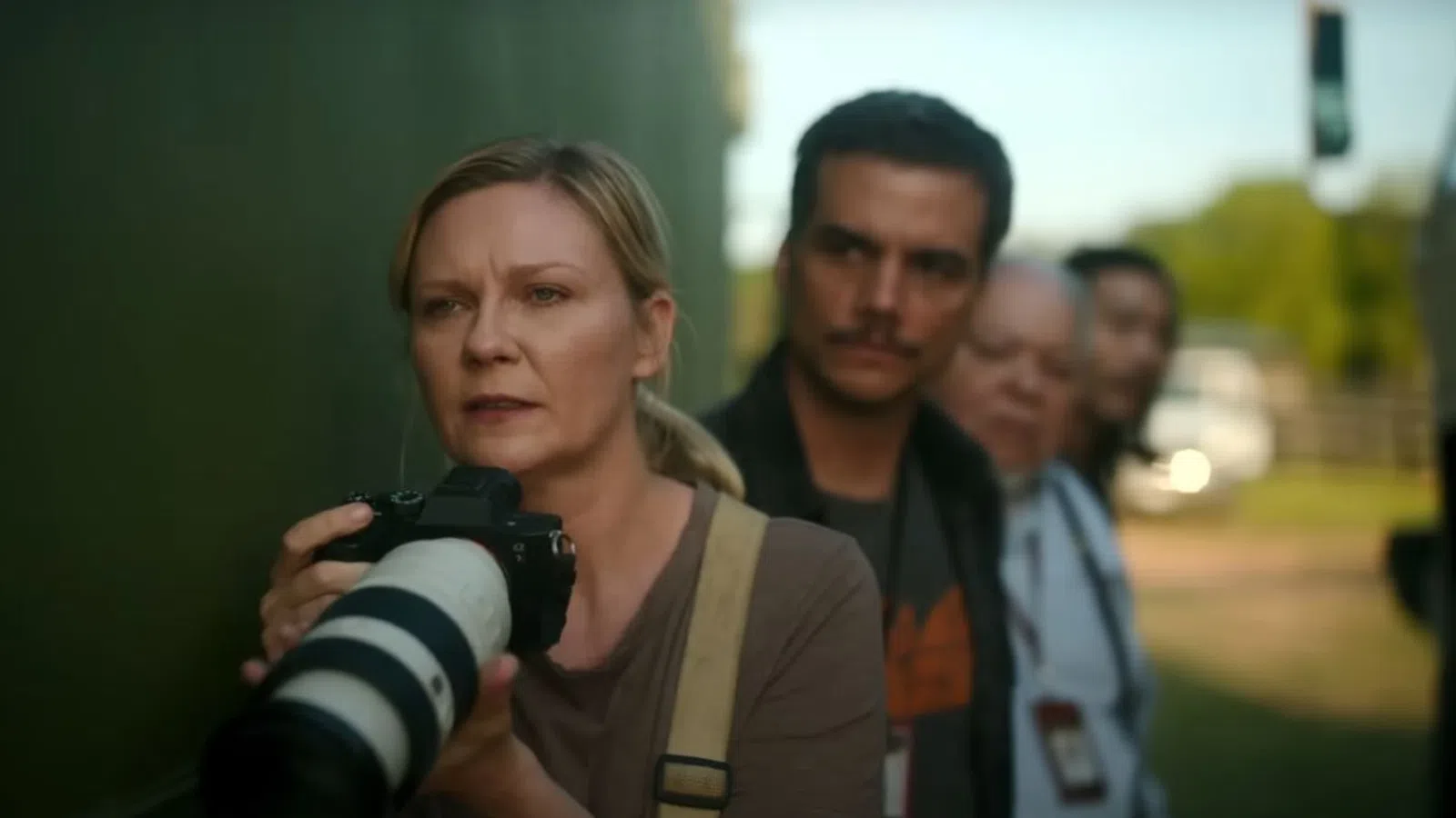 Kirsten Dunst holding a camera