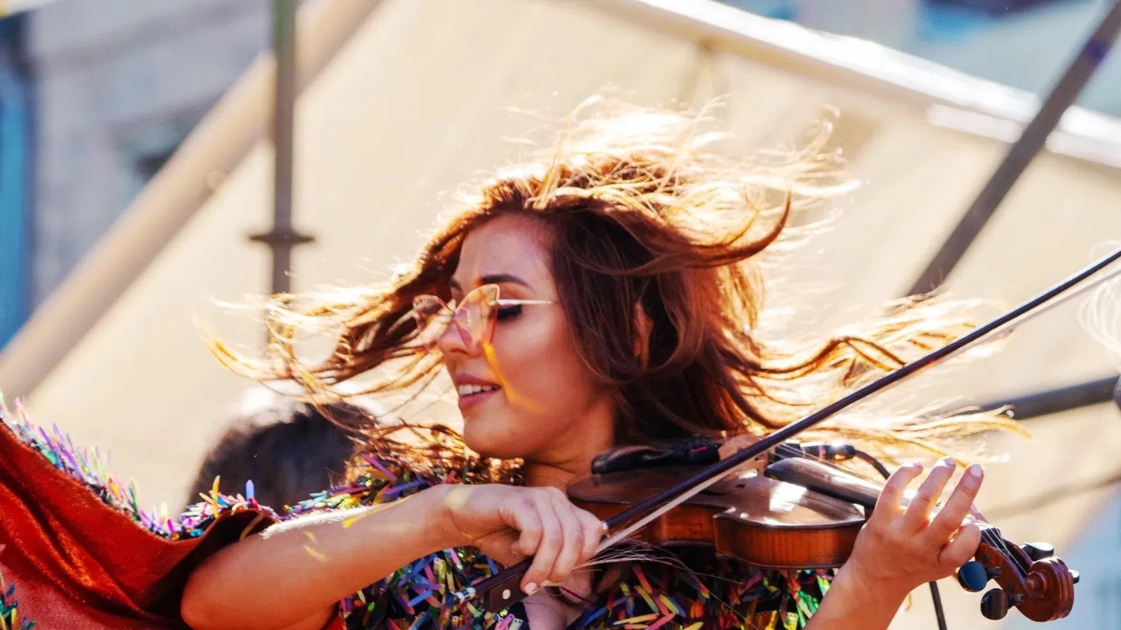 a woman playing a violin