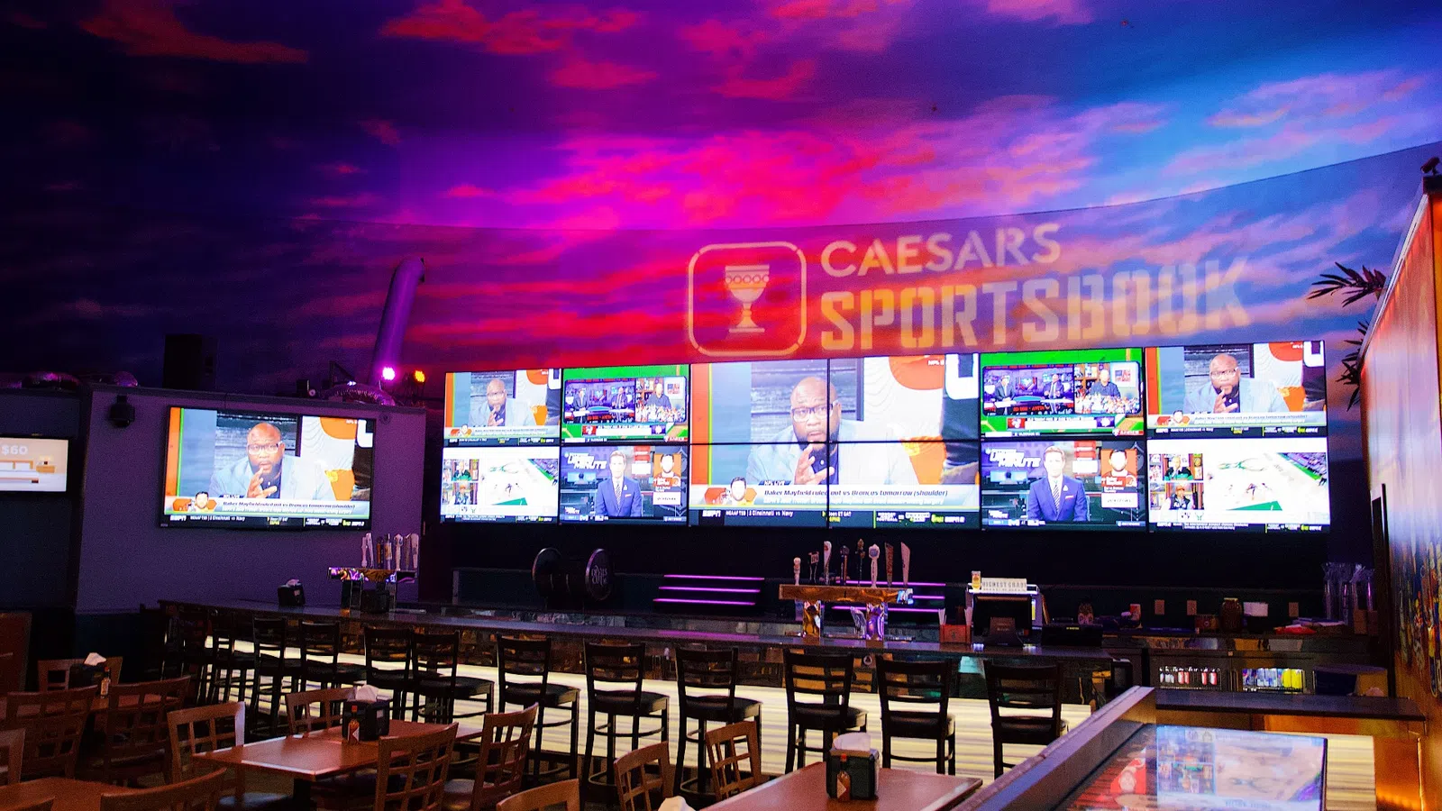a large flat screen tv sitting in a restaurant