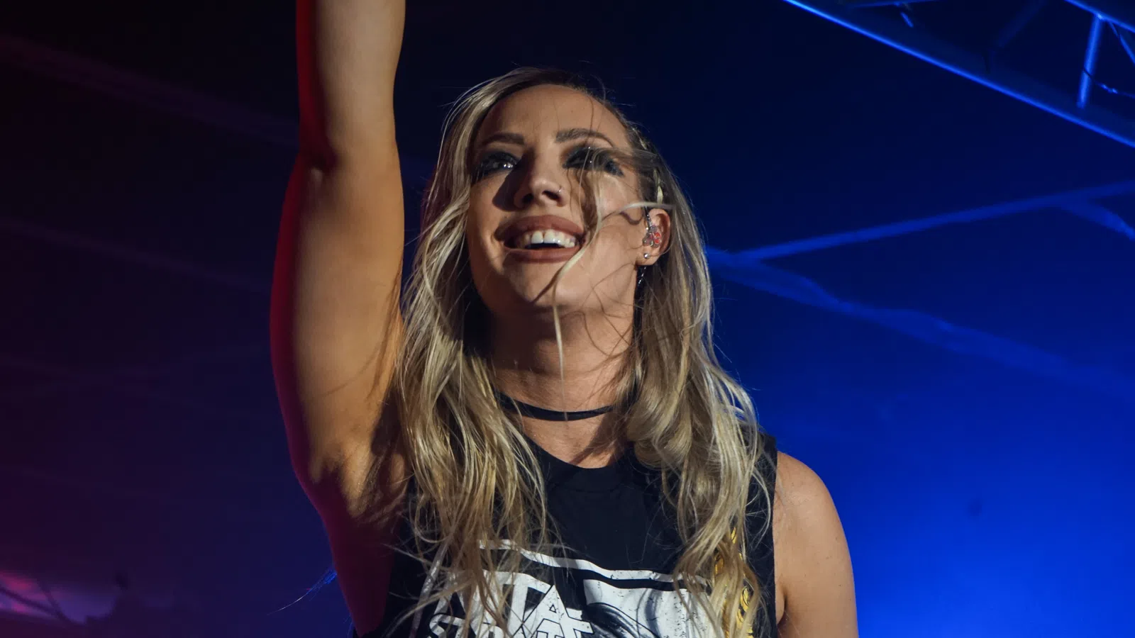 a woman with her hand up