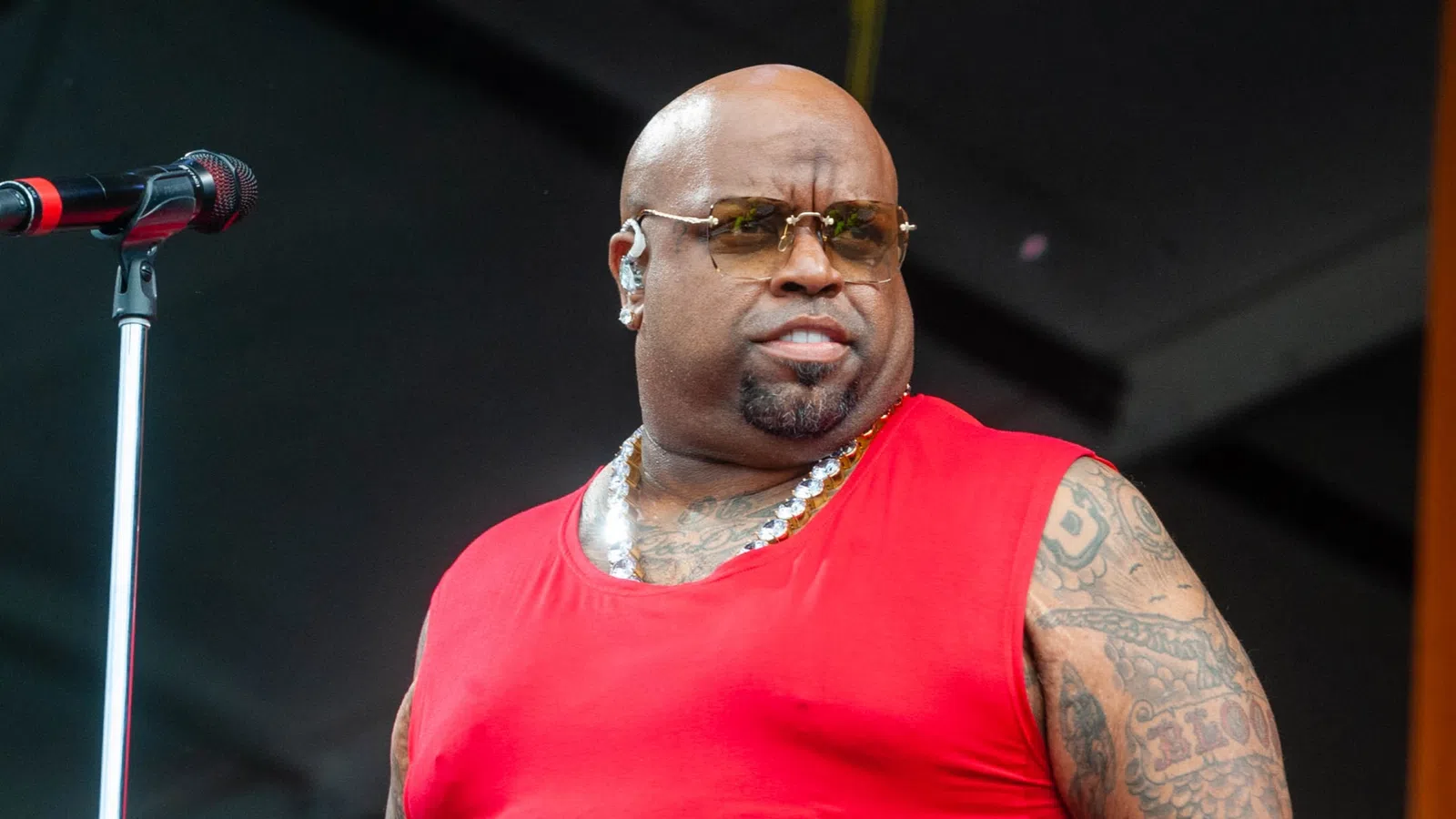 CeeLo Green with tattoos and a microphone