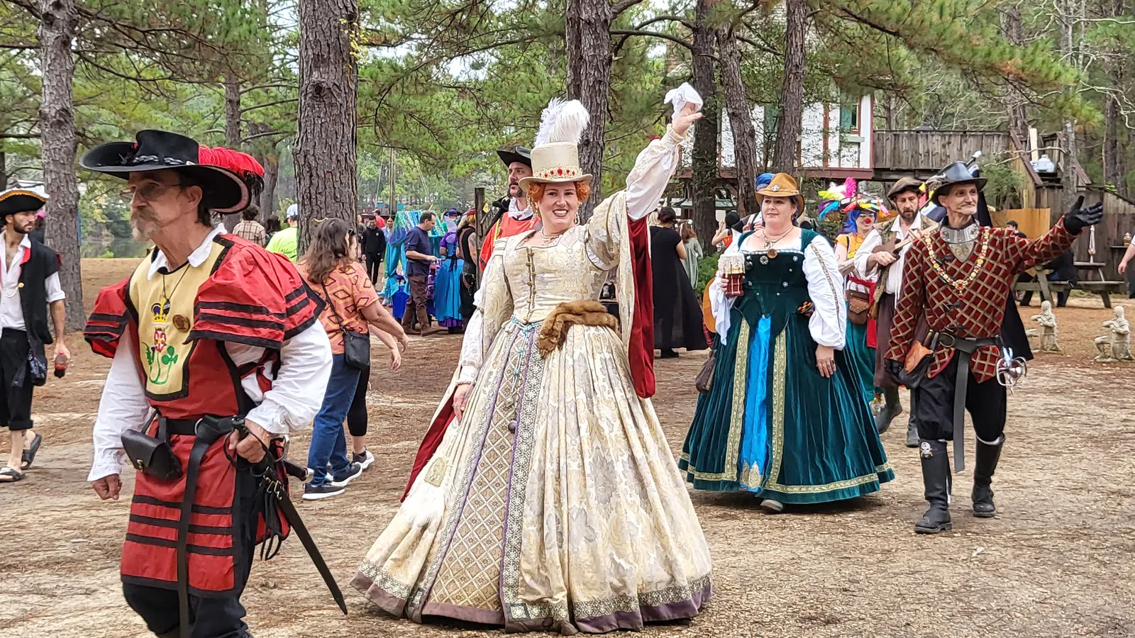 a group of people in clothing dancing