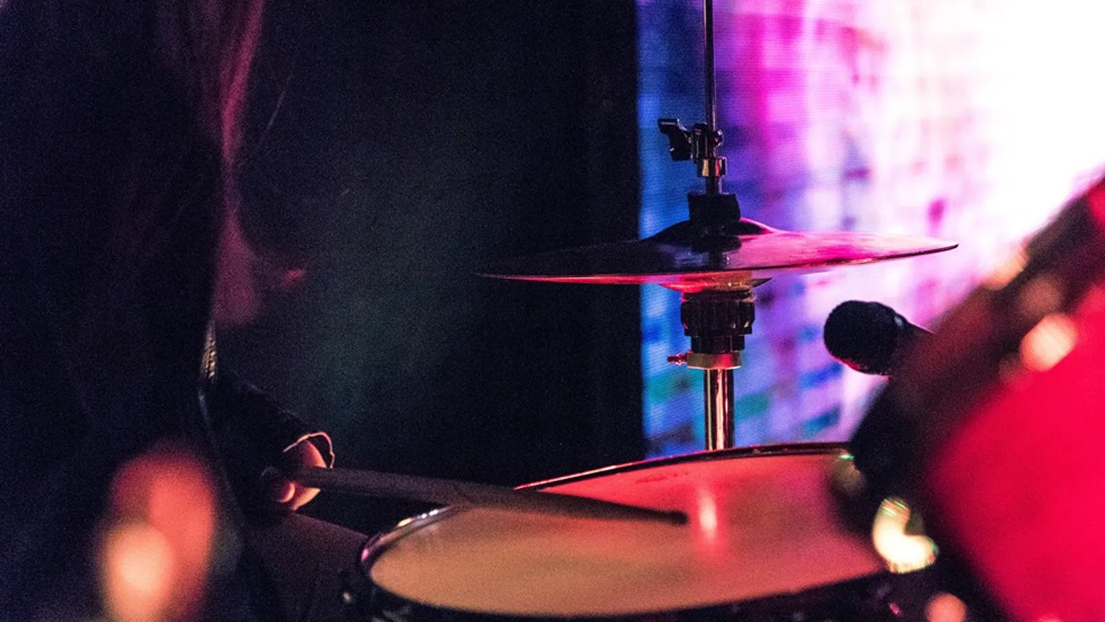 a person playing a drum set
