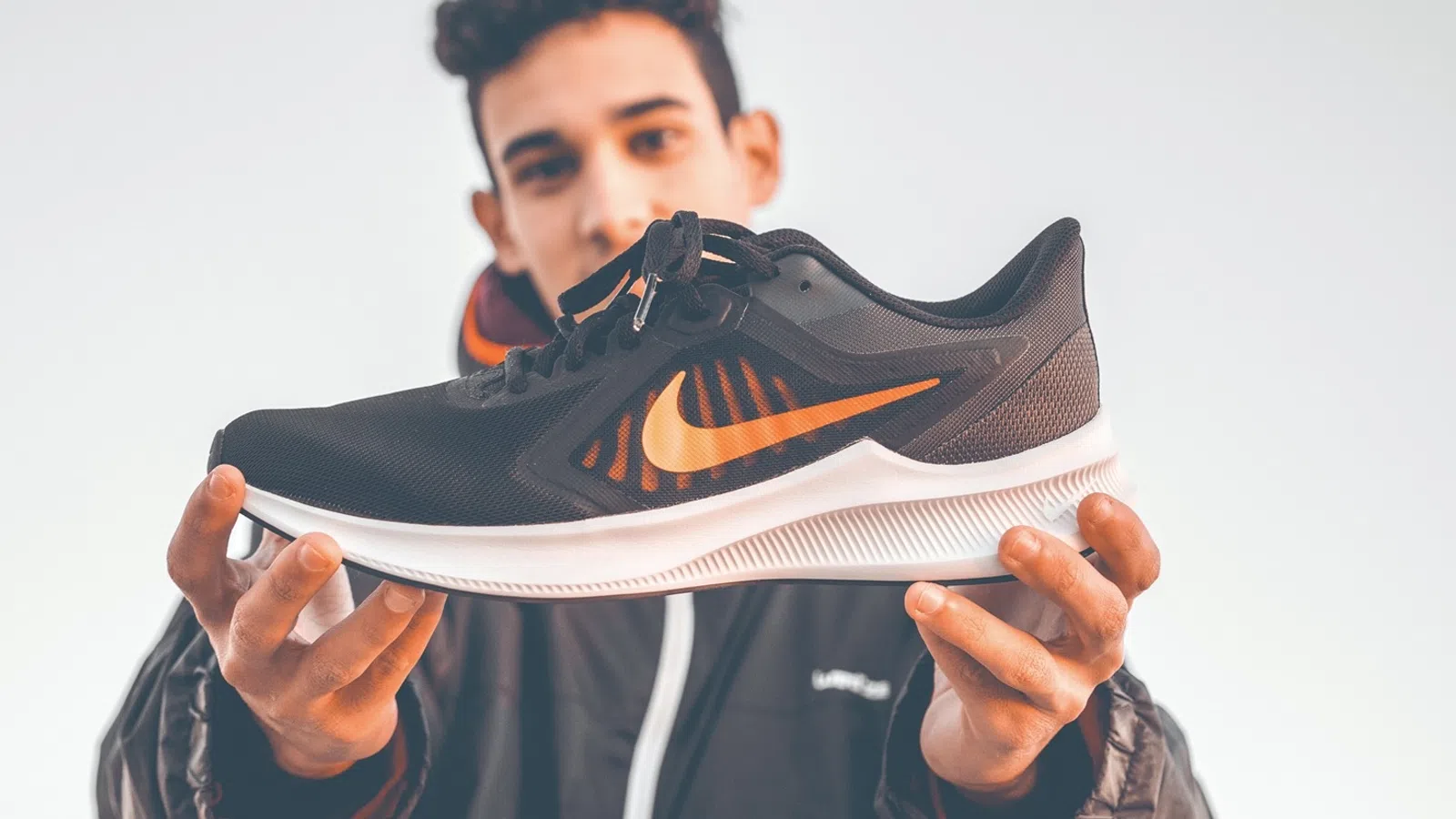 a person holding a shoe