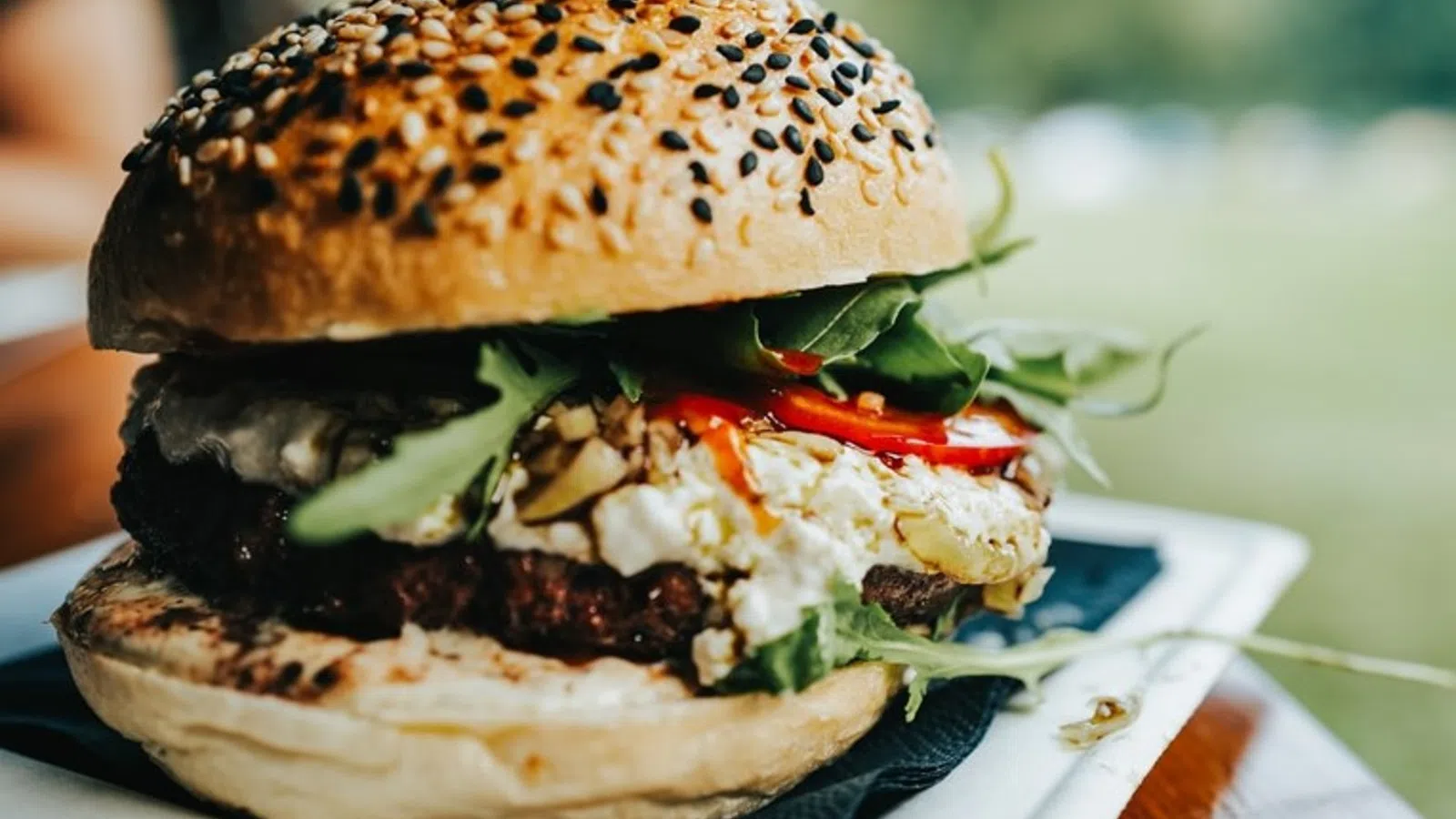 a burger with a side of salad
