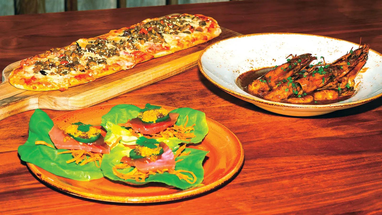 pizzas on plates on a table