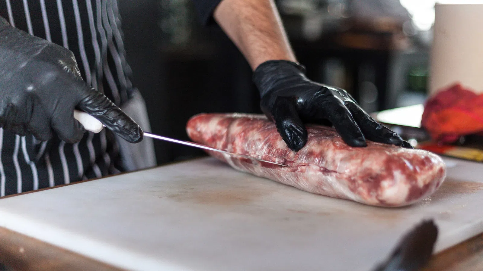 a person cutting a fish