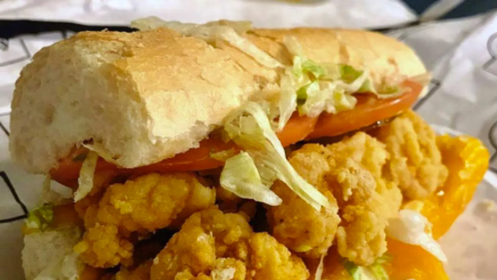 a sandwich with chips and salsa