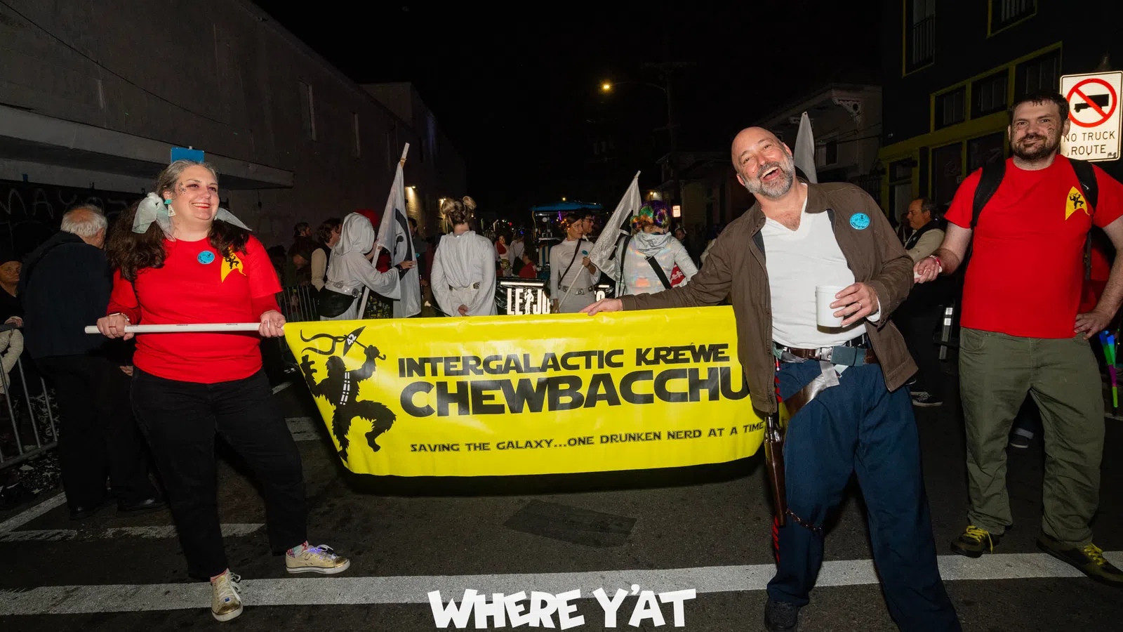 a group of people marching with a banner
