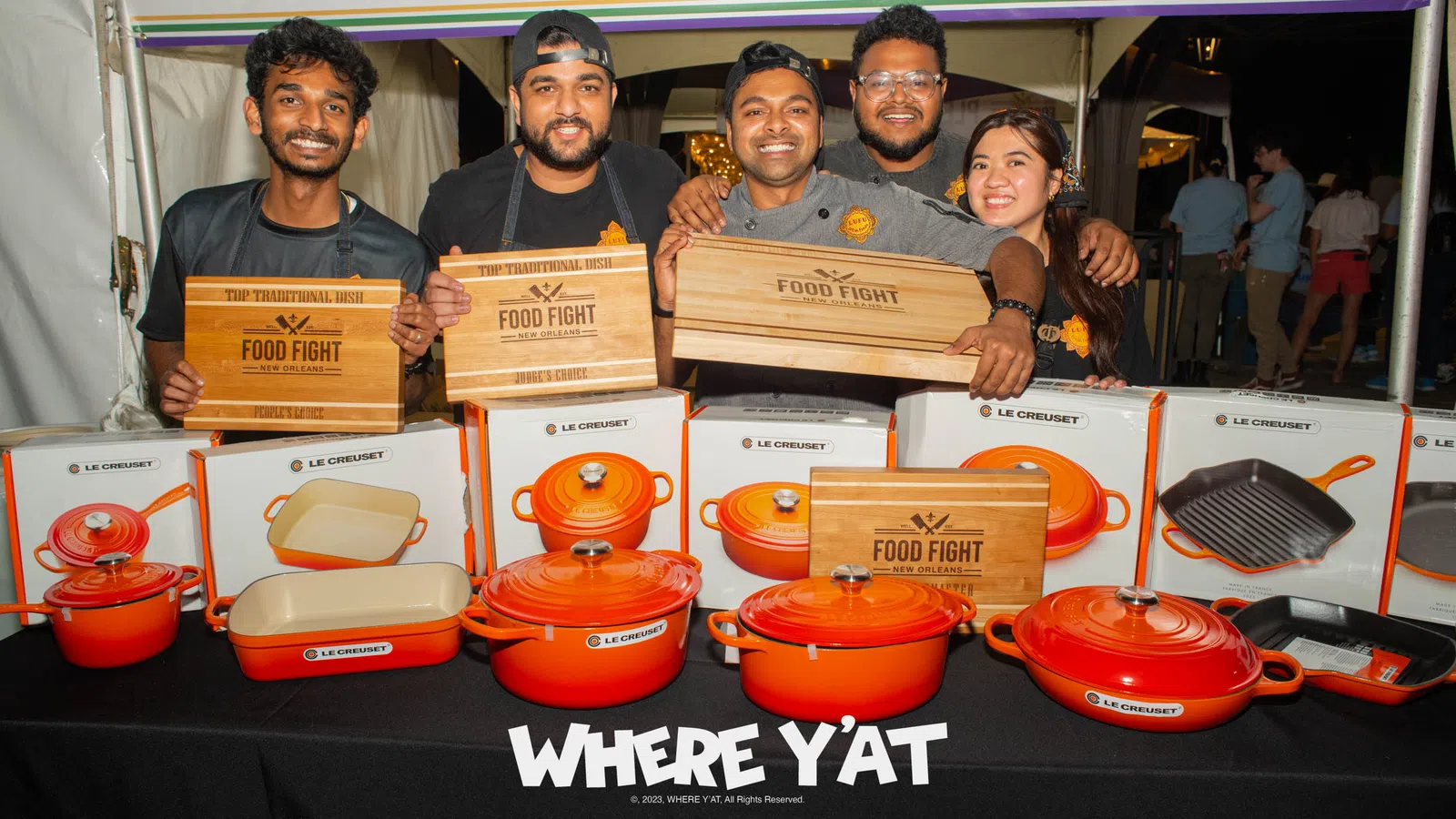 a group of people holding boxes
