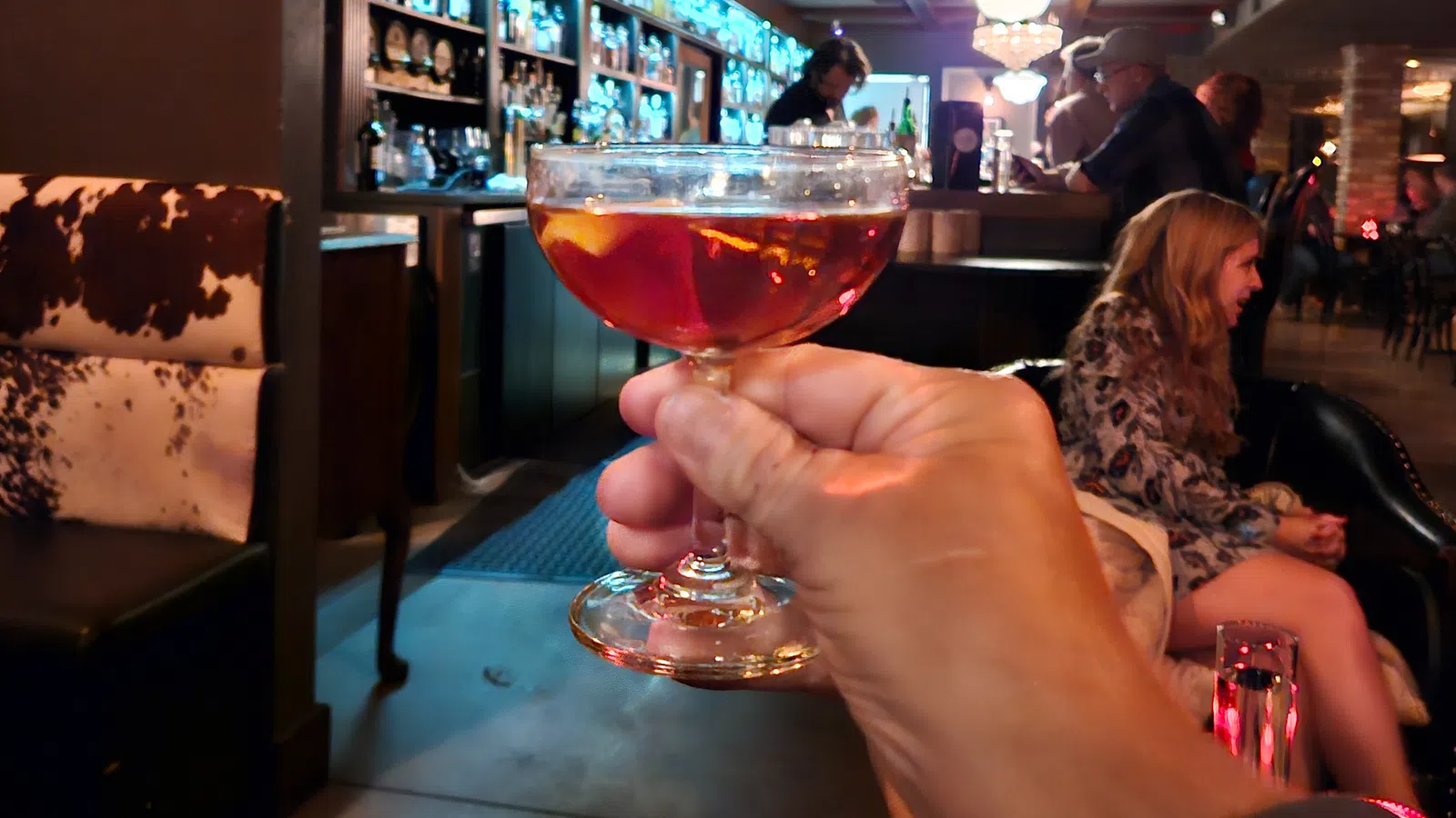 a person holding a glass of wine