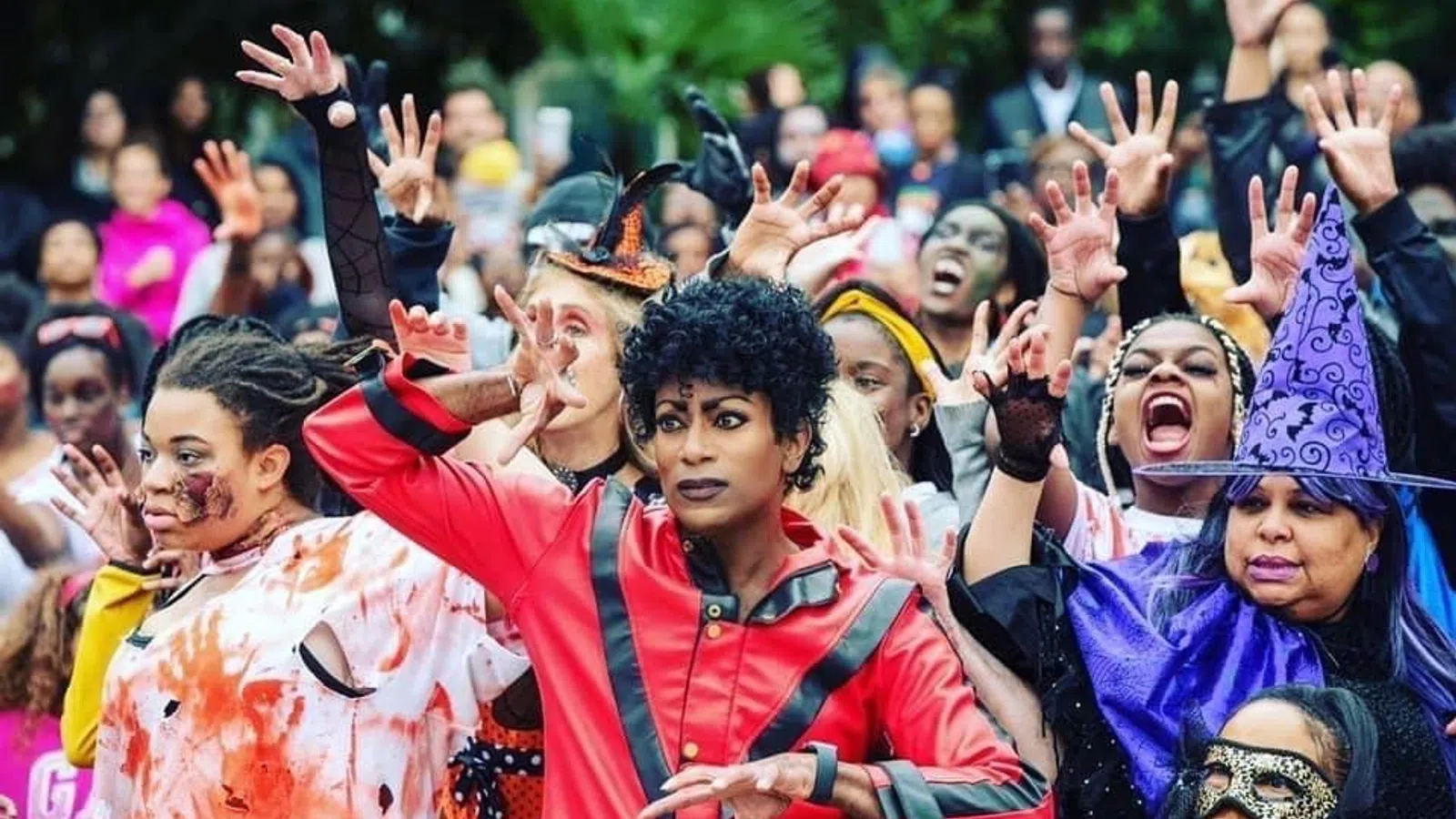 a group of people with their hands up