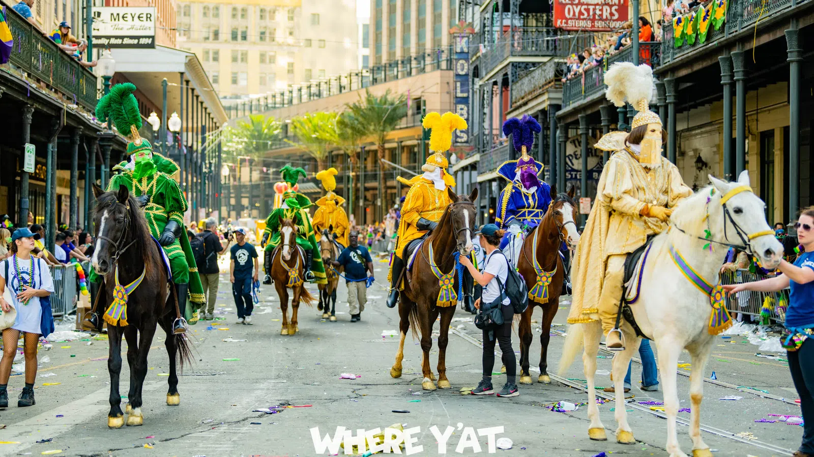 a group of people riding horses in a parade