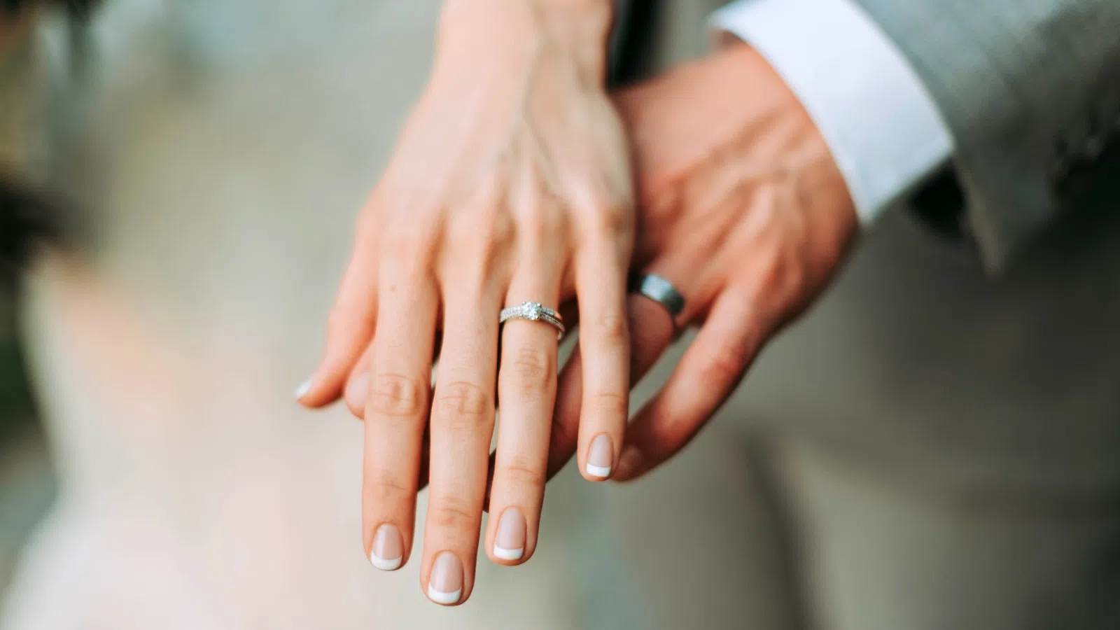 a close-up of hands holding each other